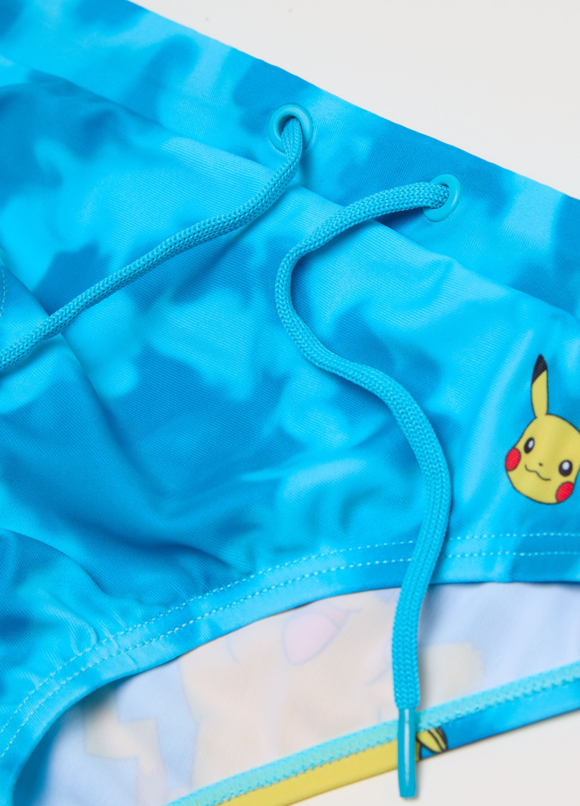 Boys’ light blue swim briefs in stretch fabric with Pikachu print