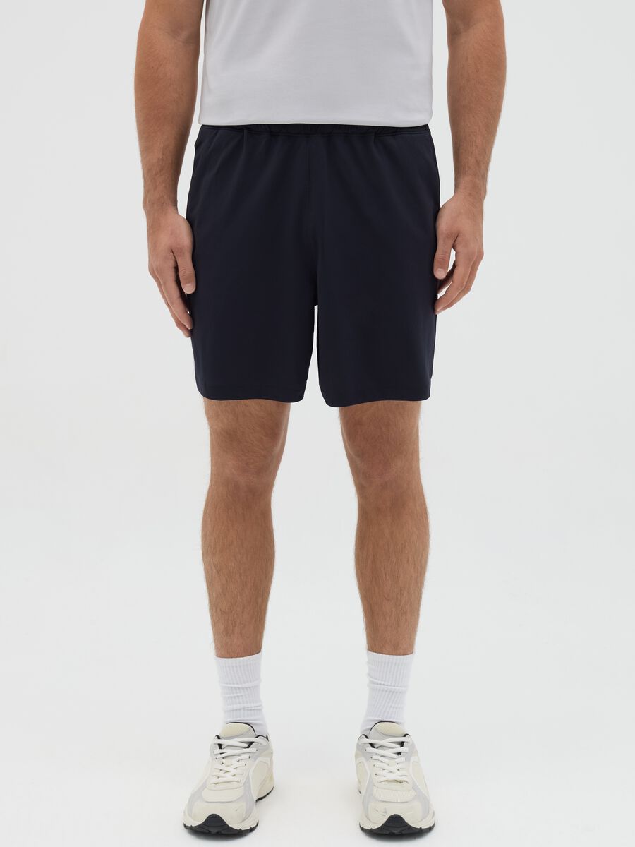 Blue Bermuda joggers in stretch fabric_1