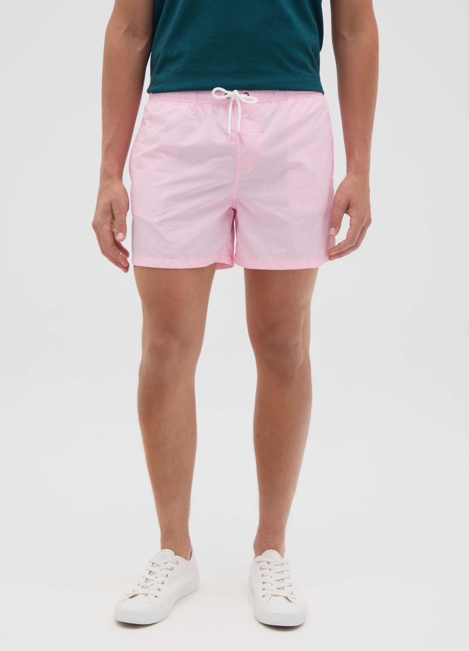 Pink swim trunks in mixed materials