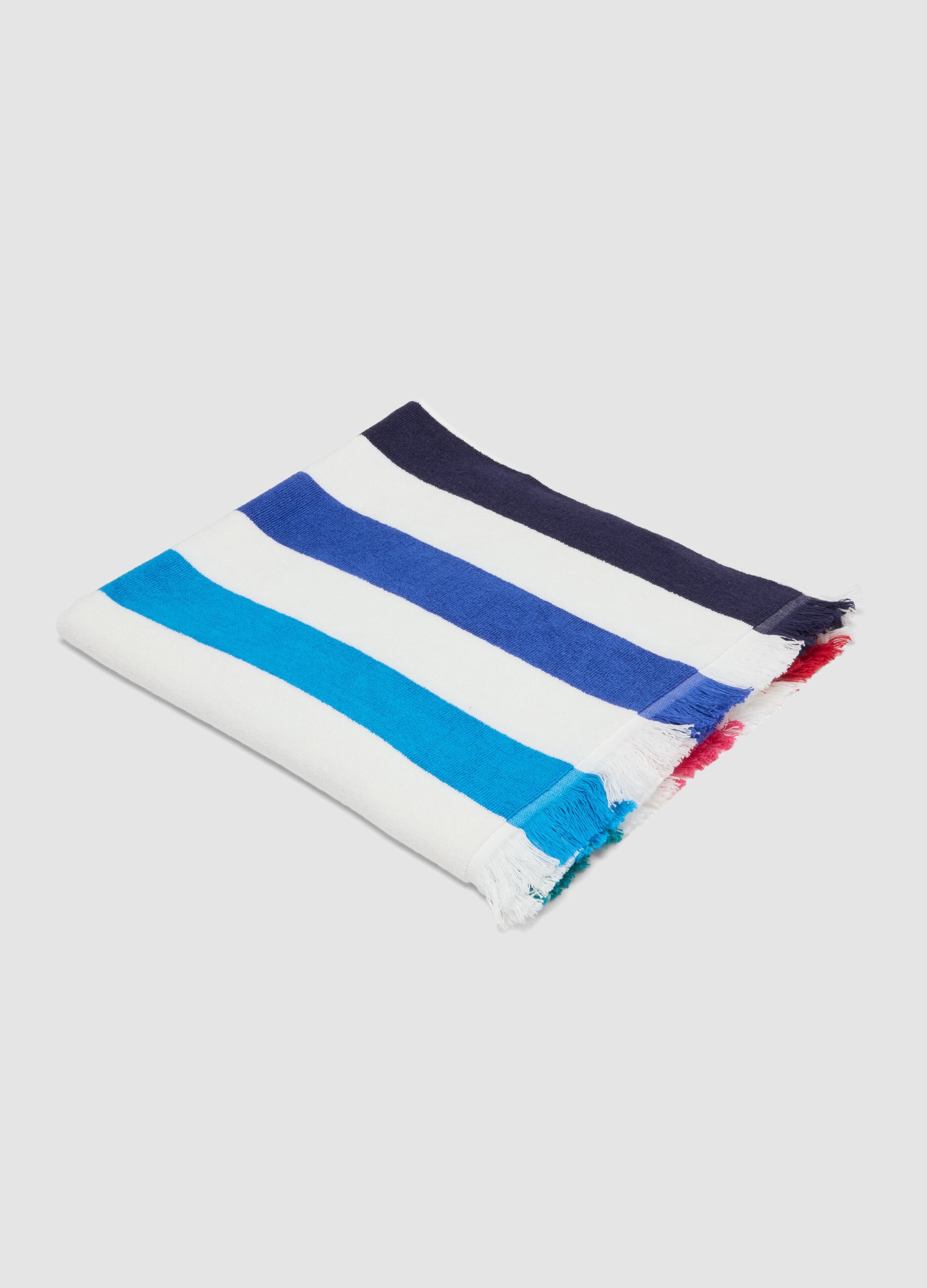 Telo mare multicolor in puro cotone a righe e con frange