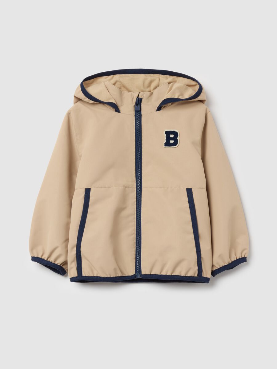 Jacket with hood and contrasting edging_0