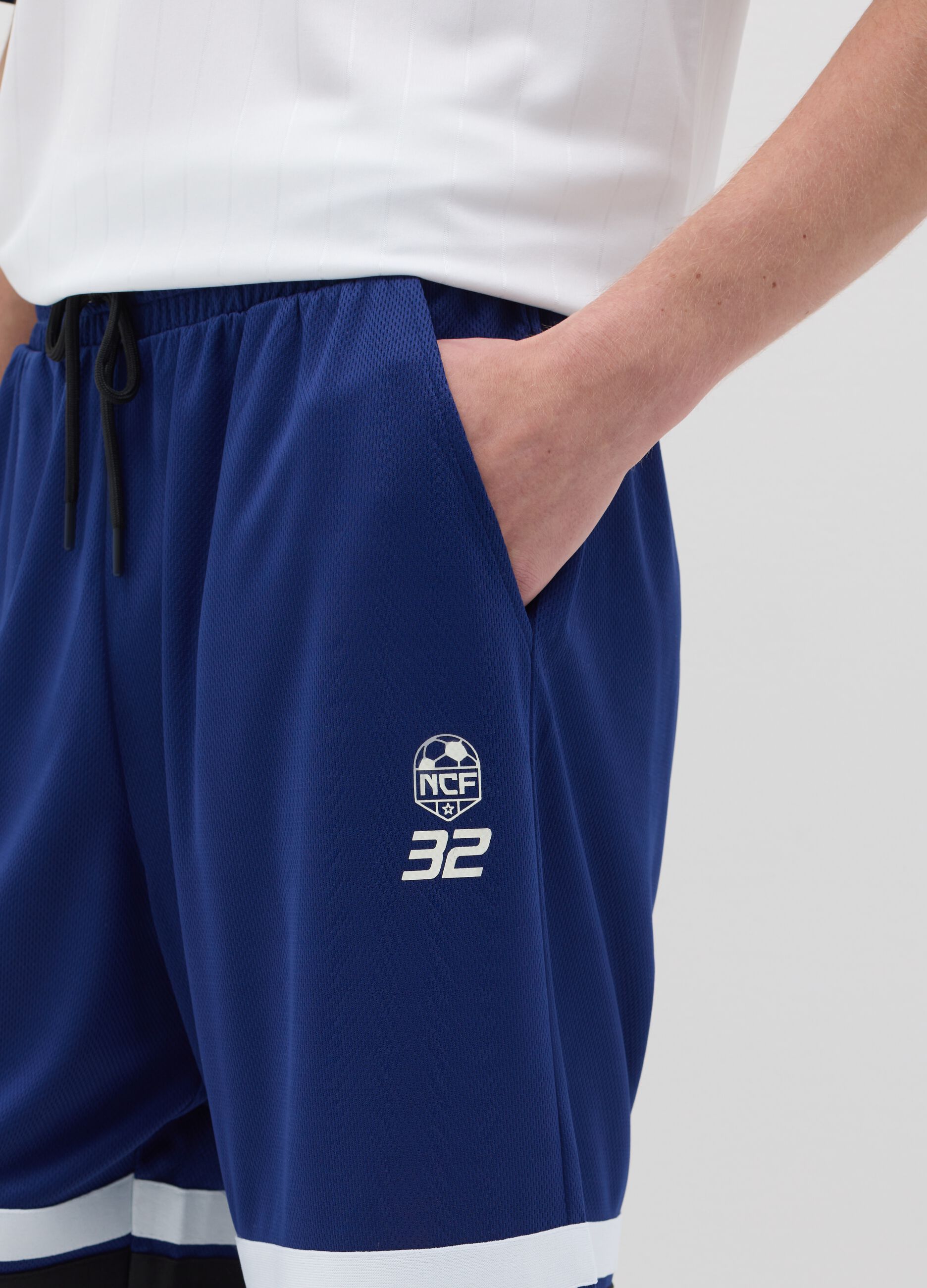 Blue Bermuda joggers with NFC print