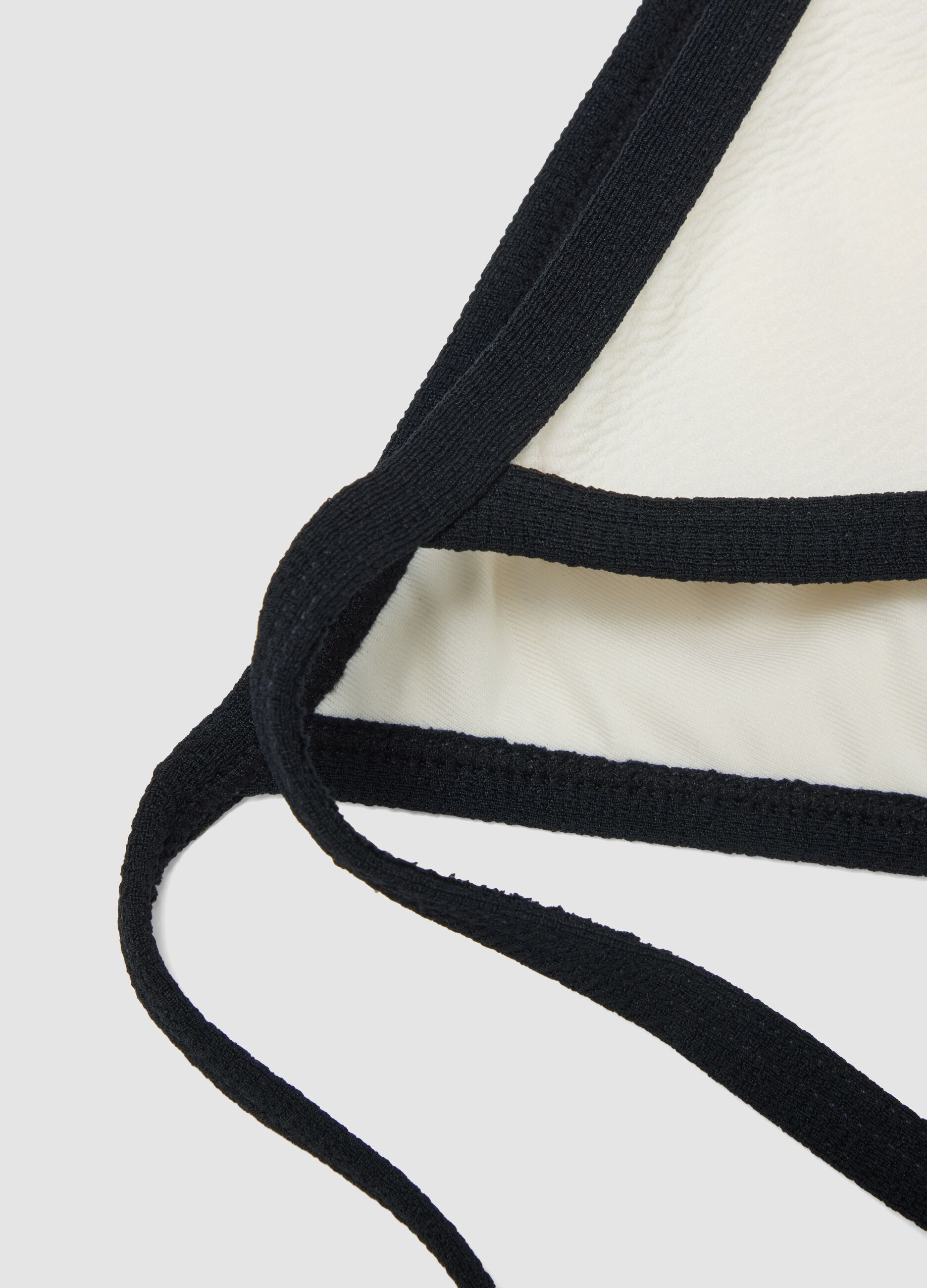 Black and white stretch bikini bottoms with tie sides