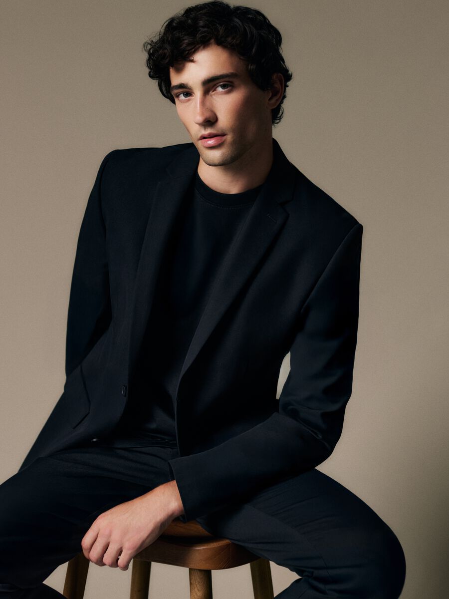 Black slim fit blazer with button closure_0