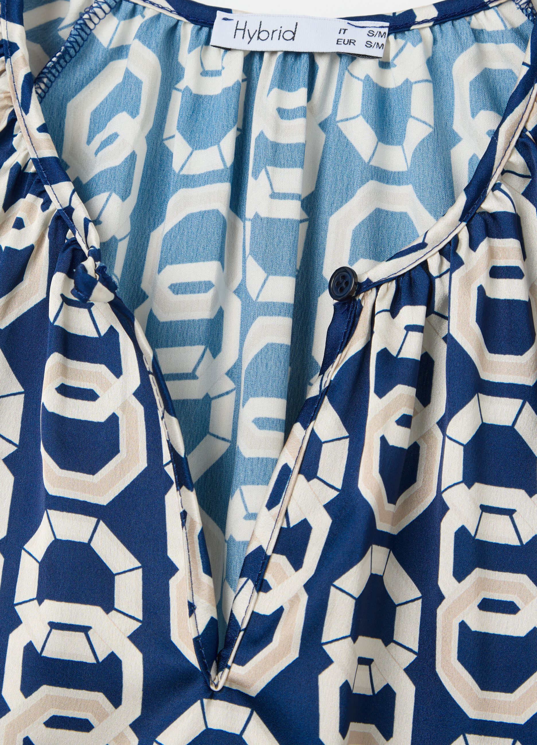 Blue long-sleeved blouse with geometric print
