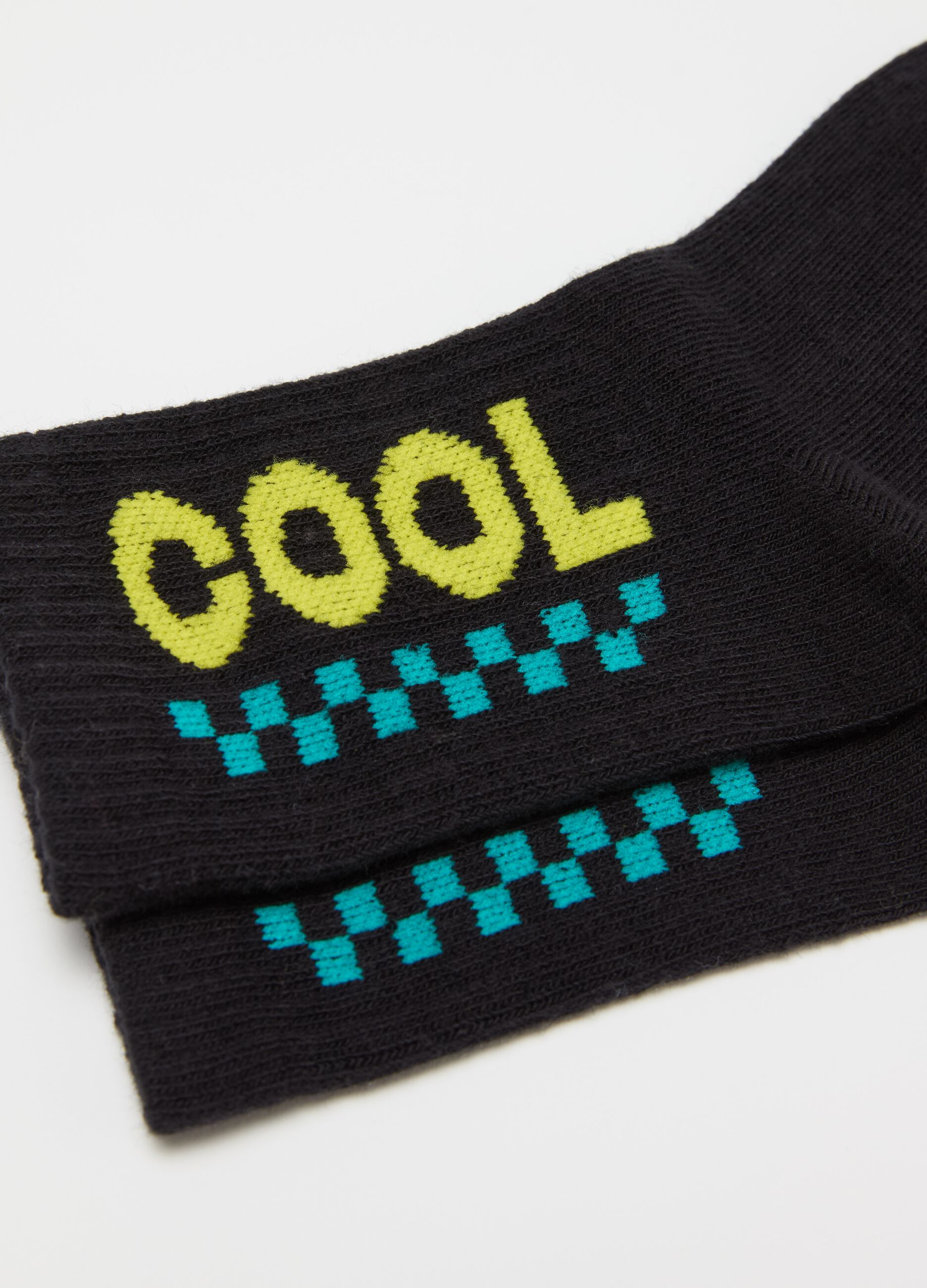 Three-pair pack tennis socks with okay design