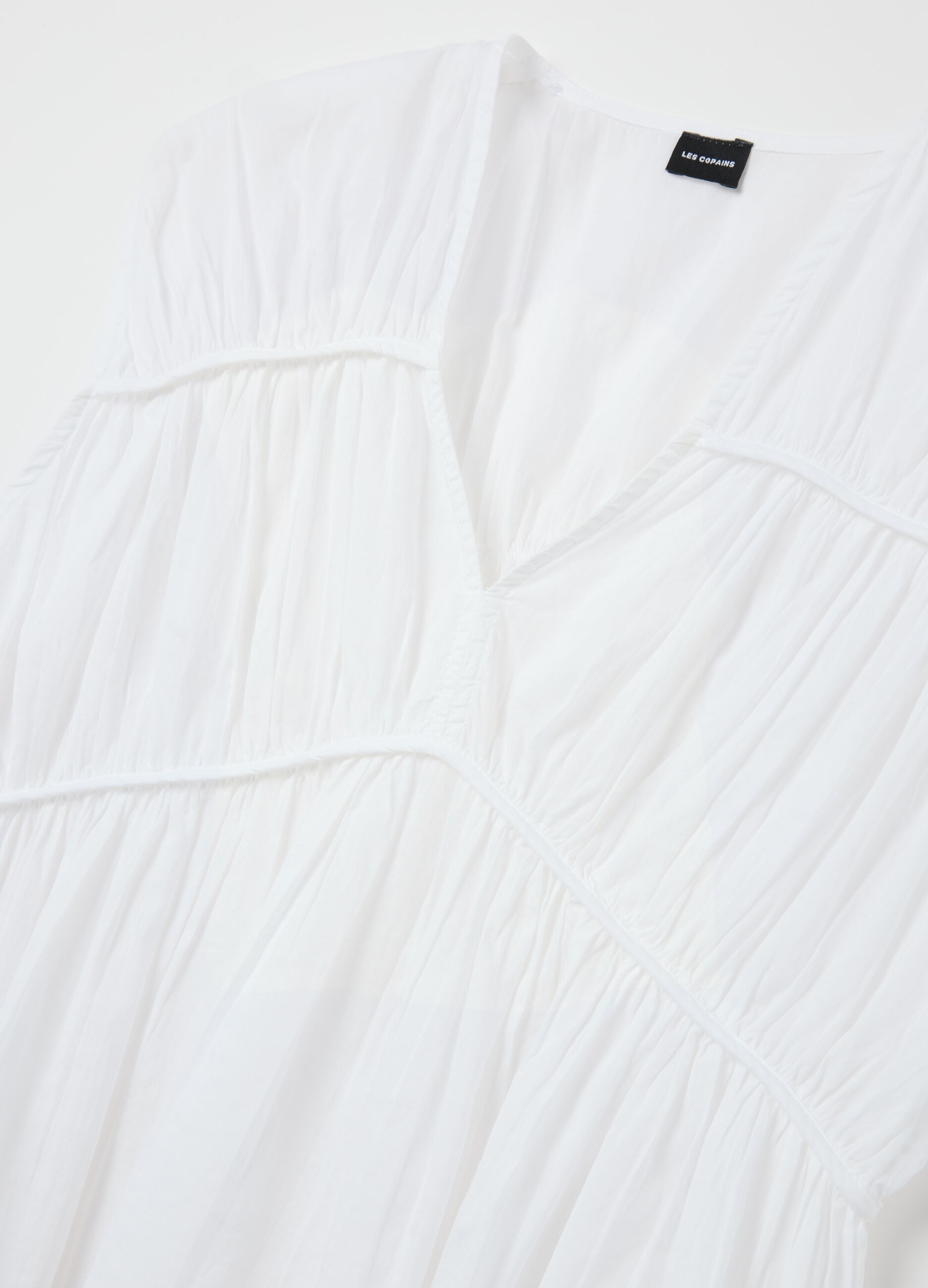Blusa smanicata in cotone bianco con arricciature