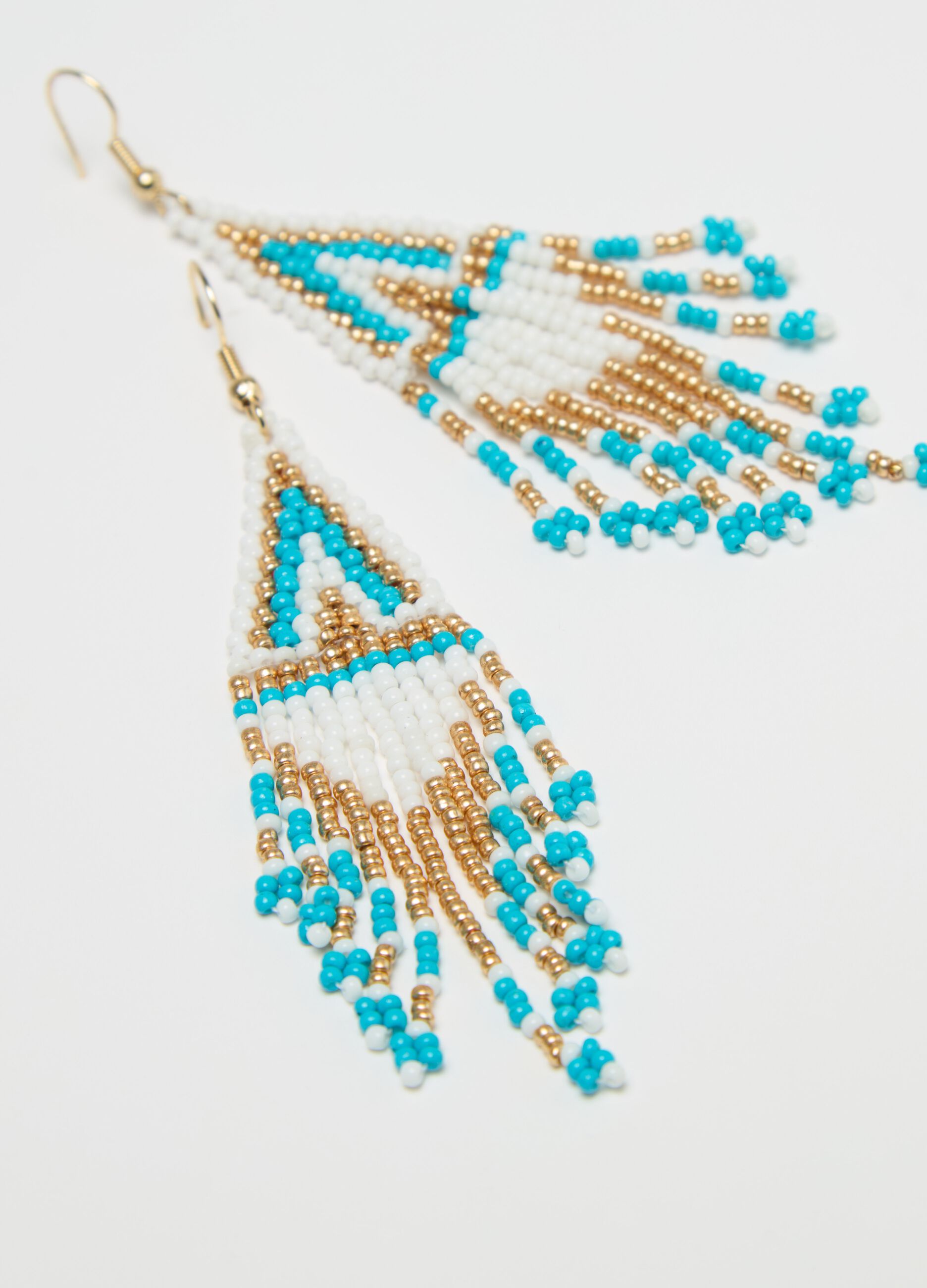 Pendant earrings with ethnic motif