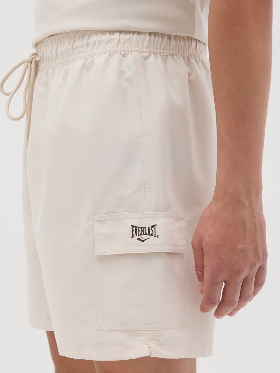 Beige swimming trunks with logo print_2