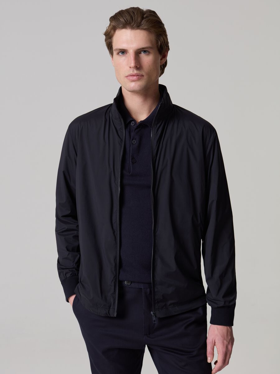 Contemporary short jacket with high neck_0