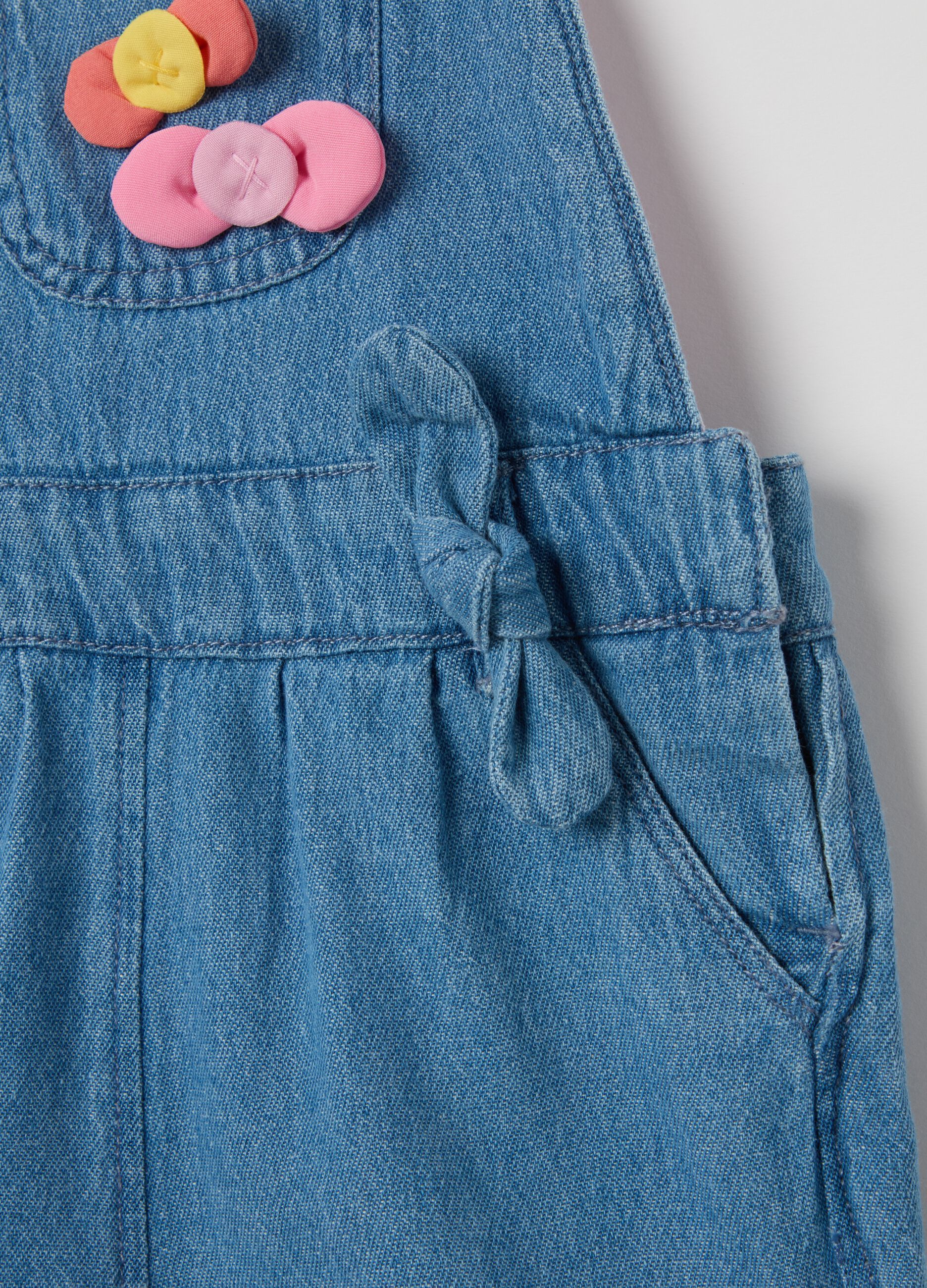 Denim dungarees with bows application