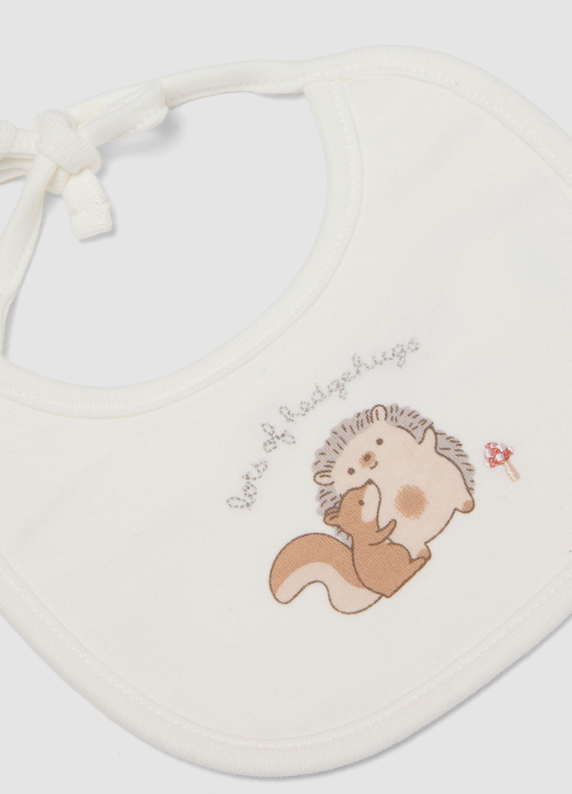 2-pack white organic cotton baby bibs with animal print