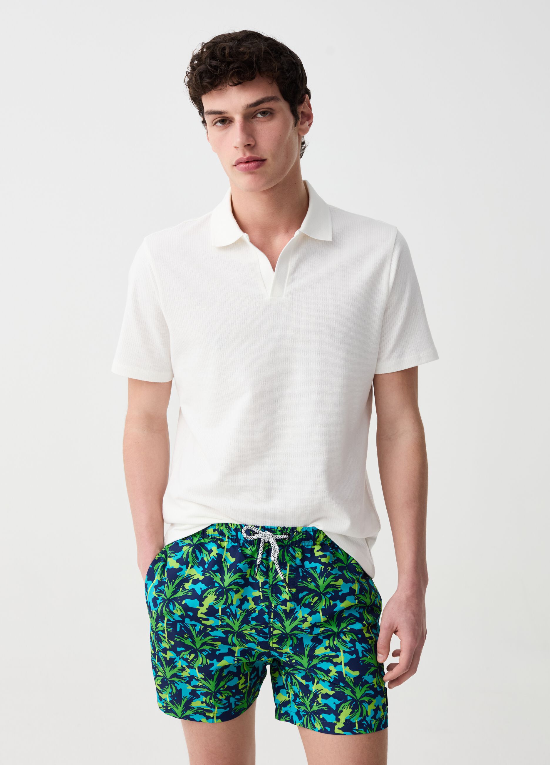Swimming trunks with palms print