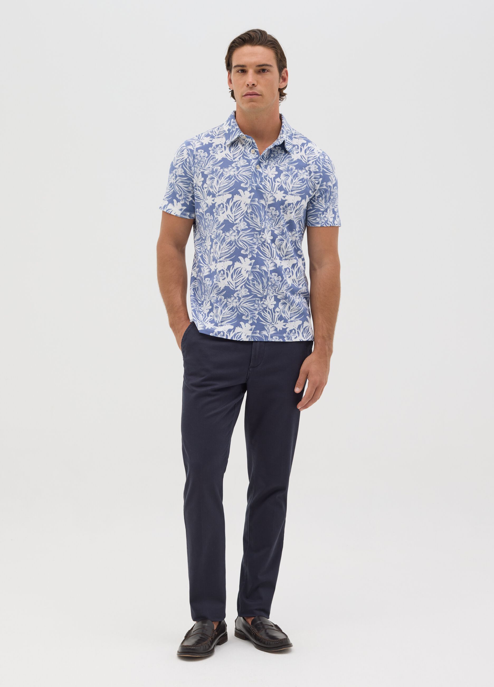 BST blue polo shirt with short sleeves and floral print