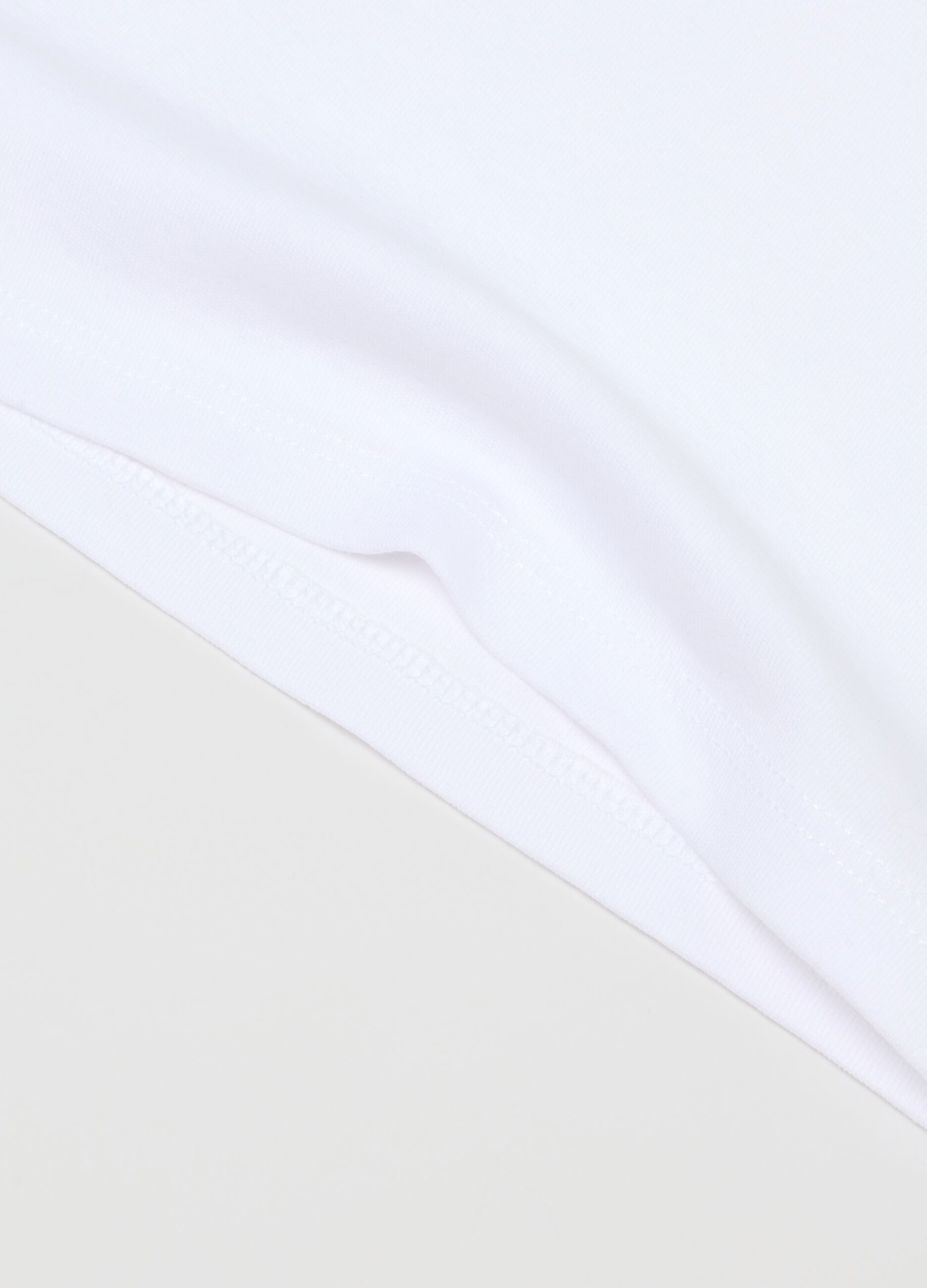 Pack of two sleeveless white cotton t-shirts for girls - regular fit