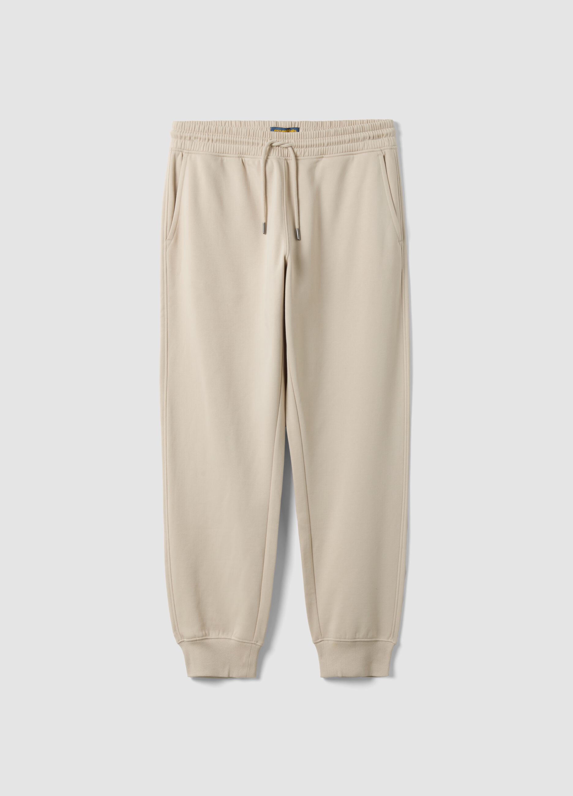 Beige cotton-blend joggers with cuffed hems and drawstring
