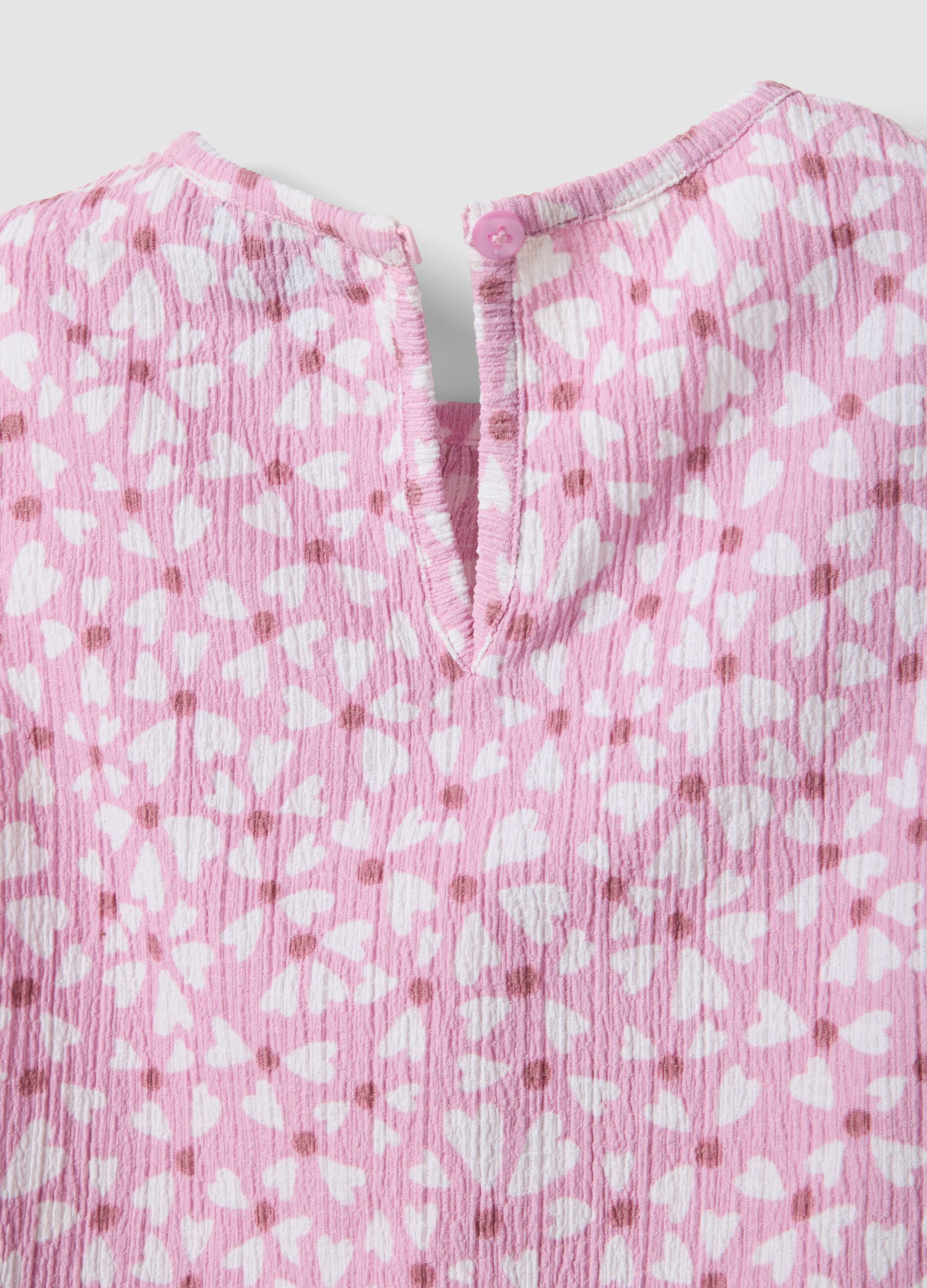 Pink stretch-fabric set with top and shorts