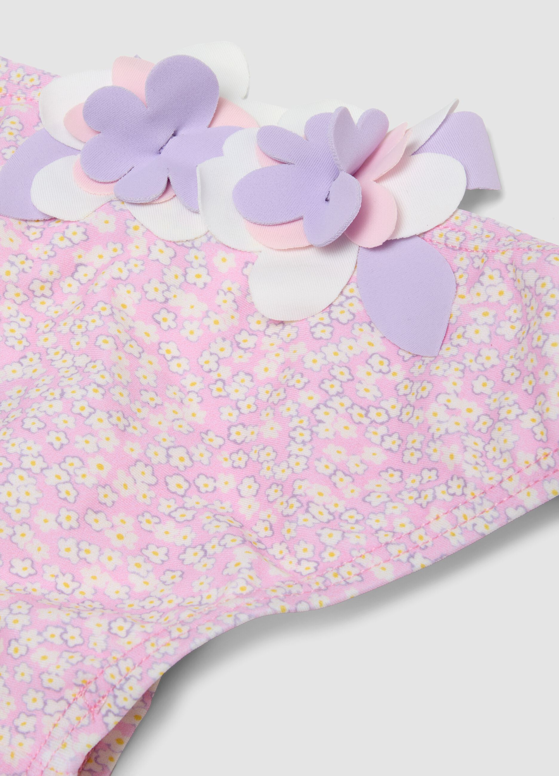 Pink stretch swim briefs with applied floral details