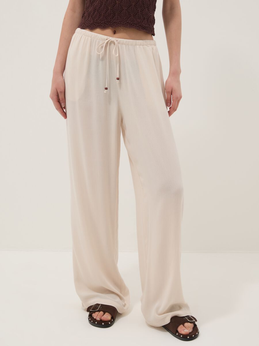 Beige palazzo trousers in pure viscose_1