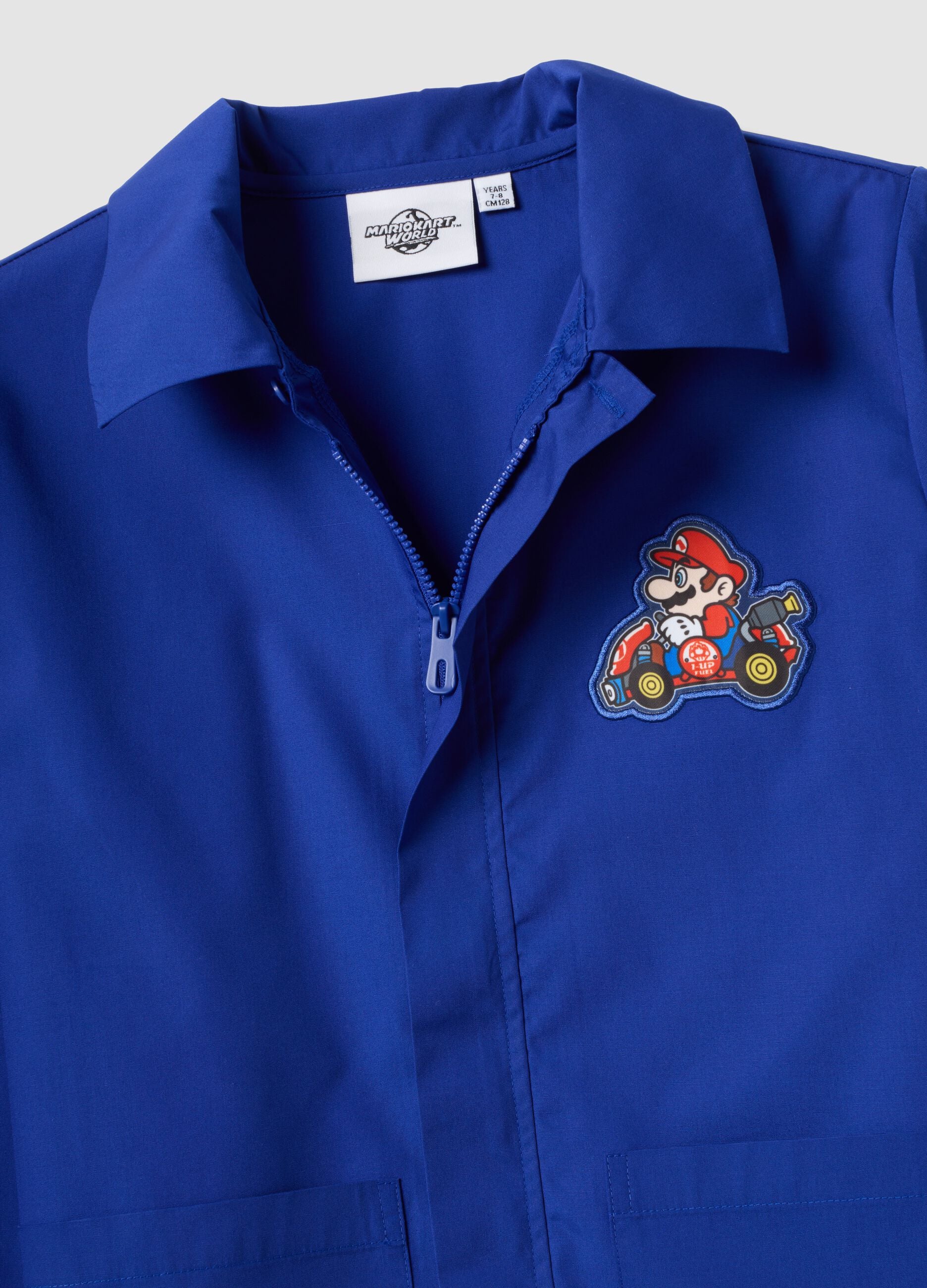 Blue boys&rsquo; school apron with zip and Mario Kart embroidery