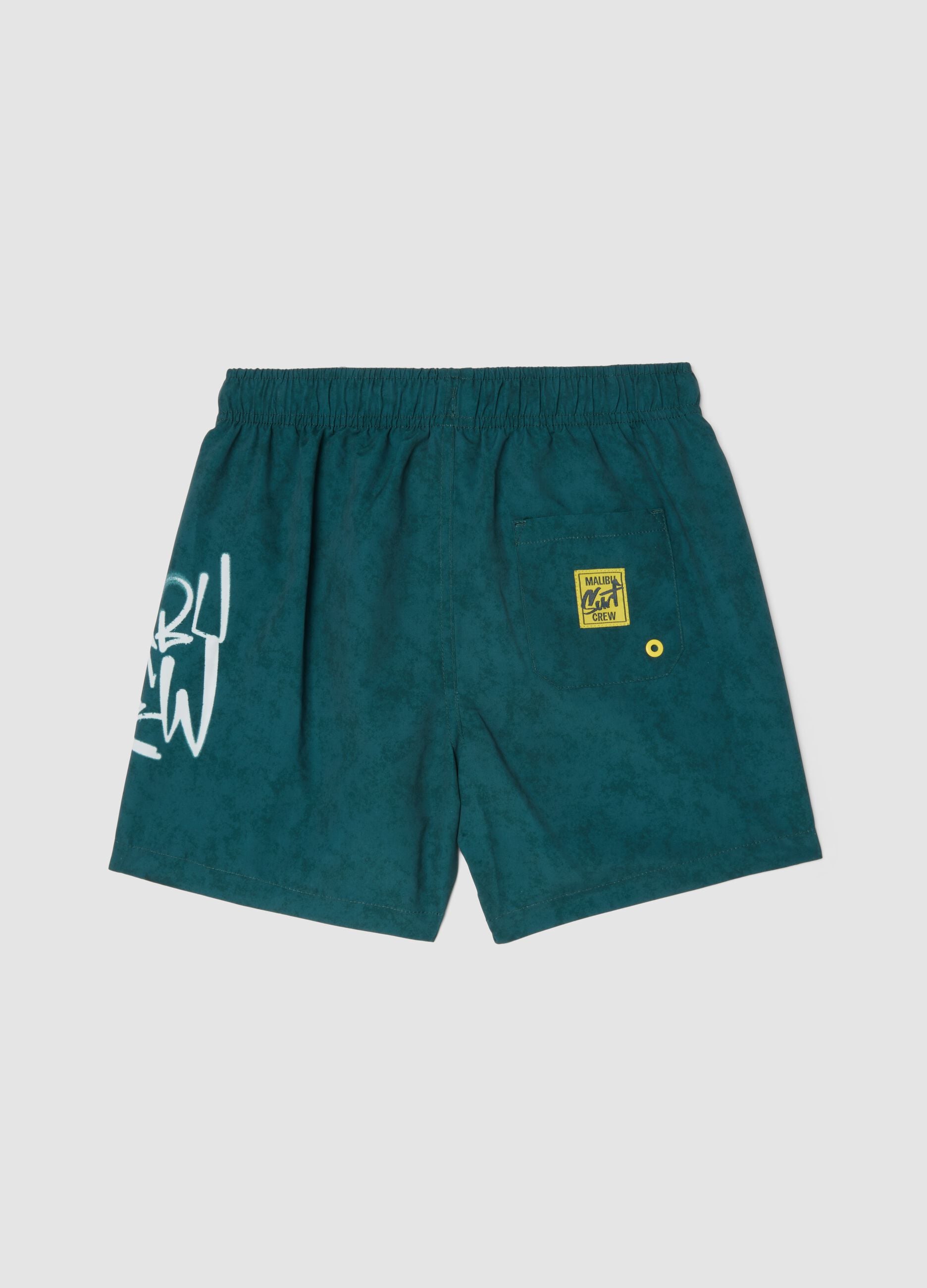 Green swim shorts with graphic print