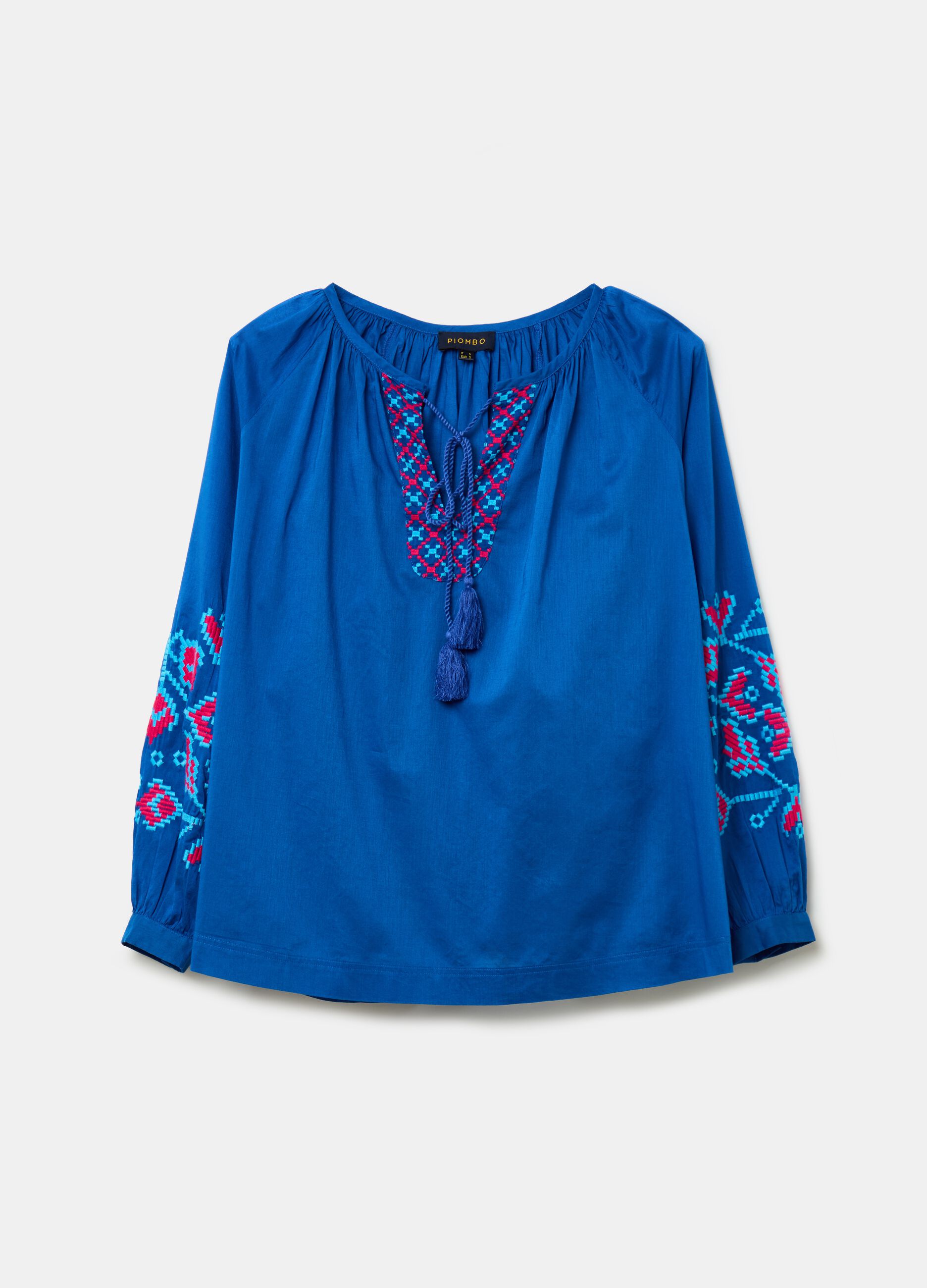 Blusa over con ricami etnici e nappine