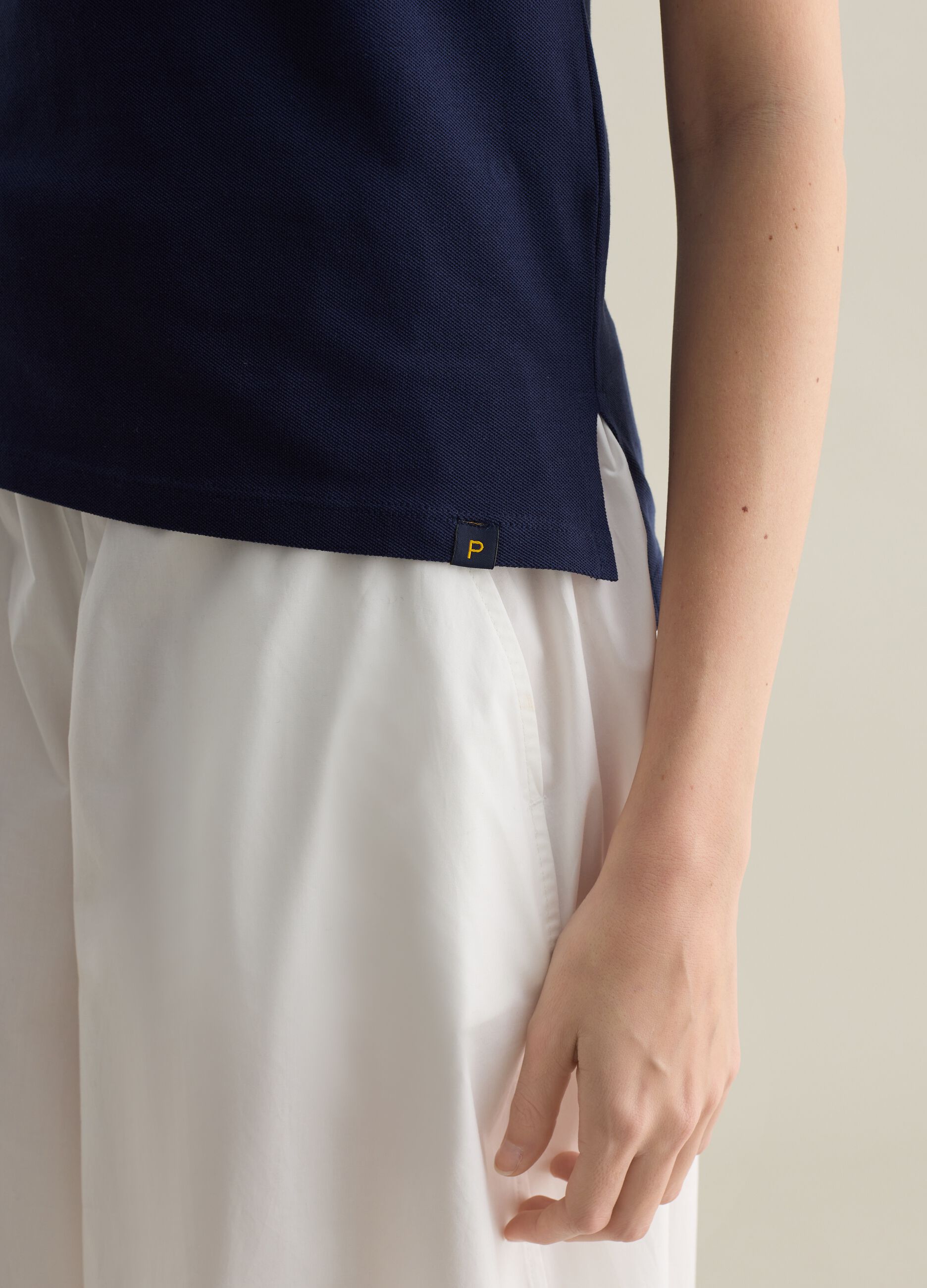 Blue short-sleeved polo shirt in piquet