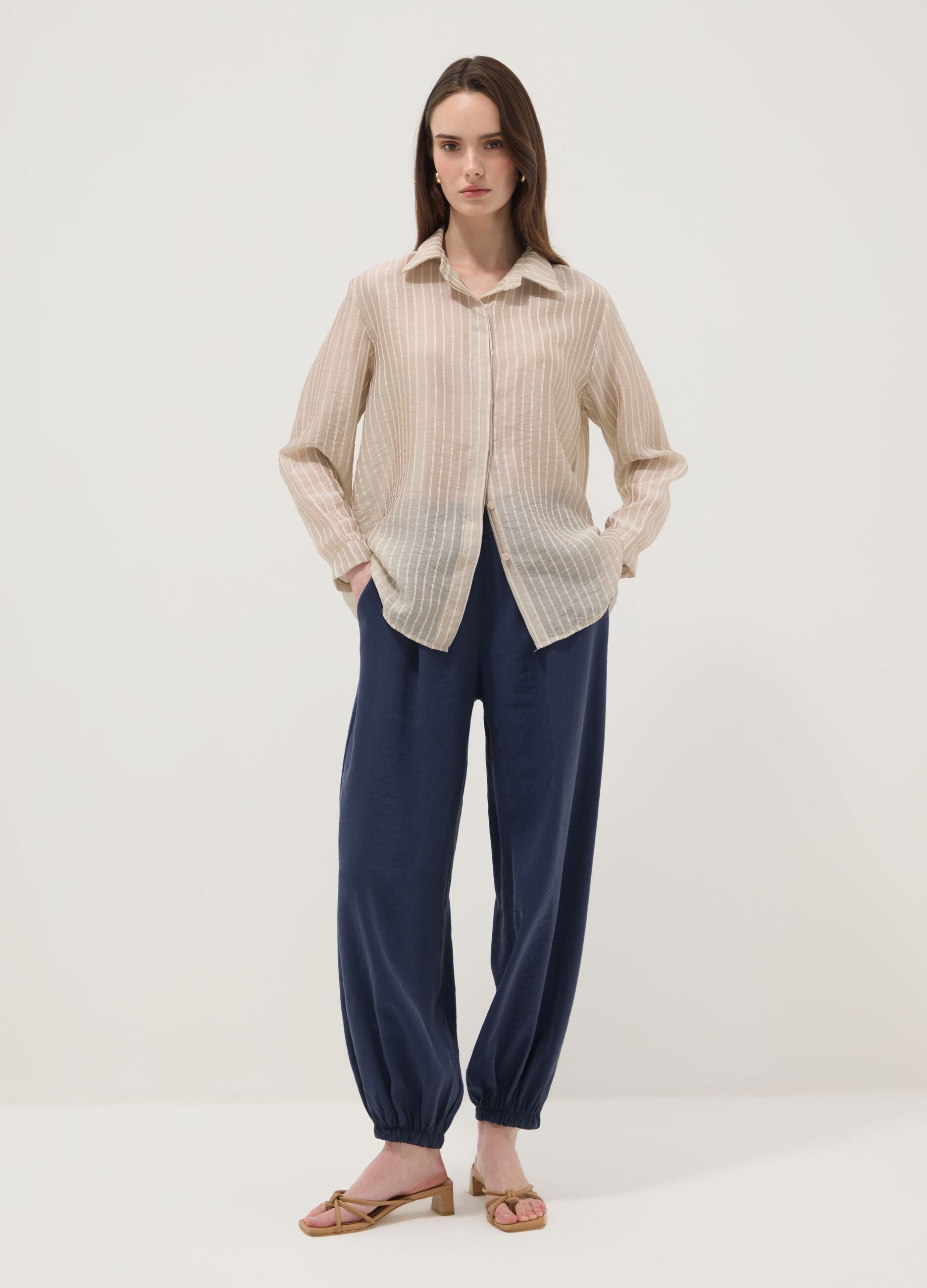 Blue viscose-blend trousers with elasticated cuffs, regular fit