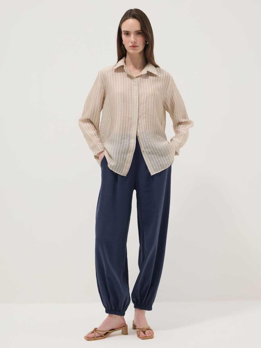 Blue viscose-blend trousers with elasticated cuffs, regular fit_0