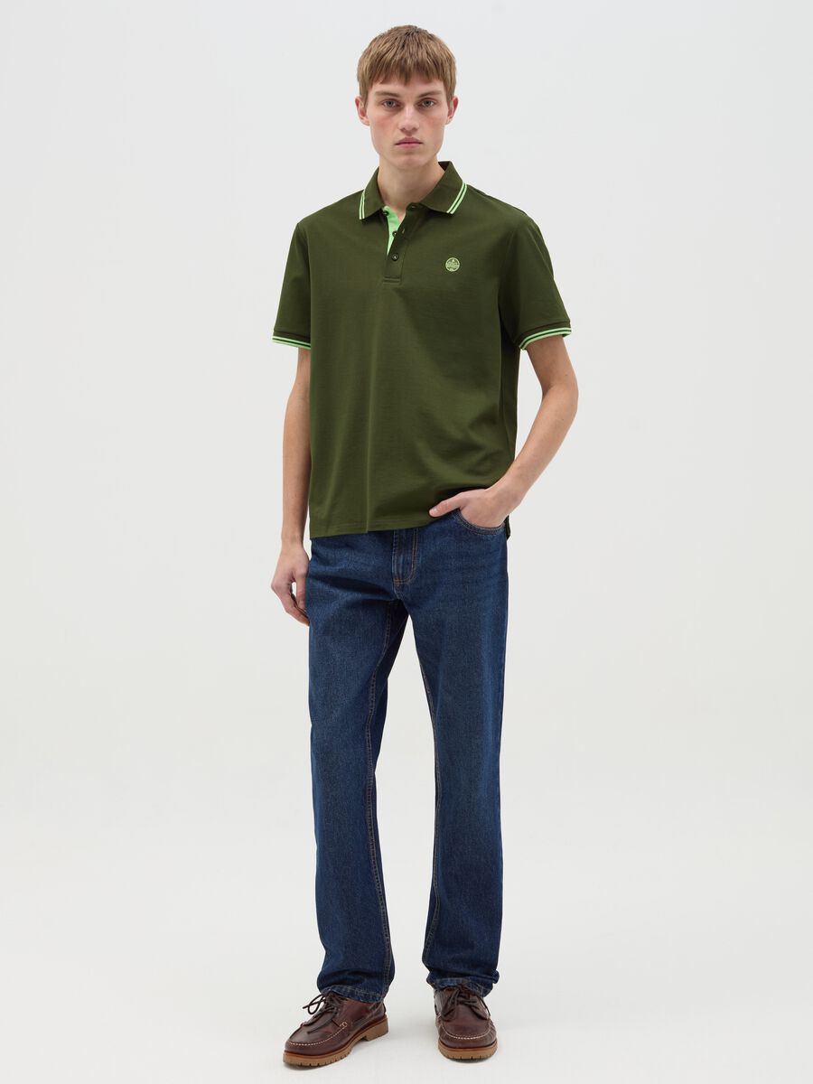 Polo shirt with striped edging and logo embroidery_1