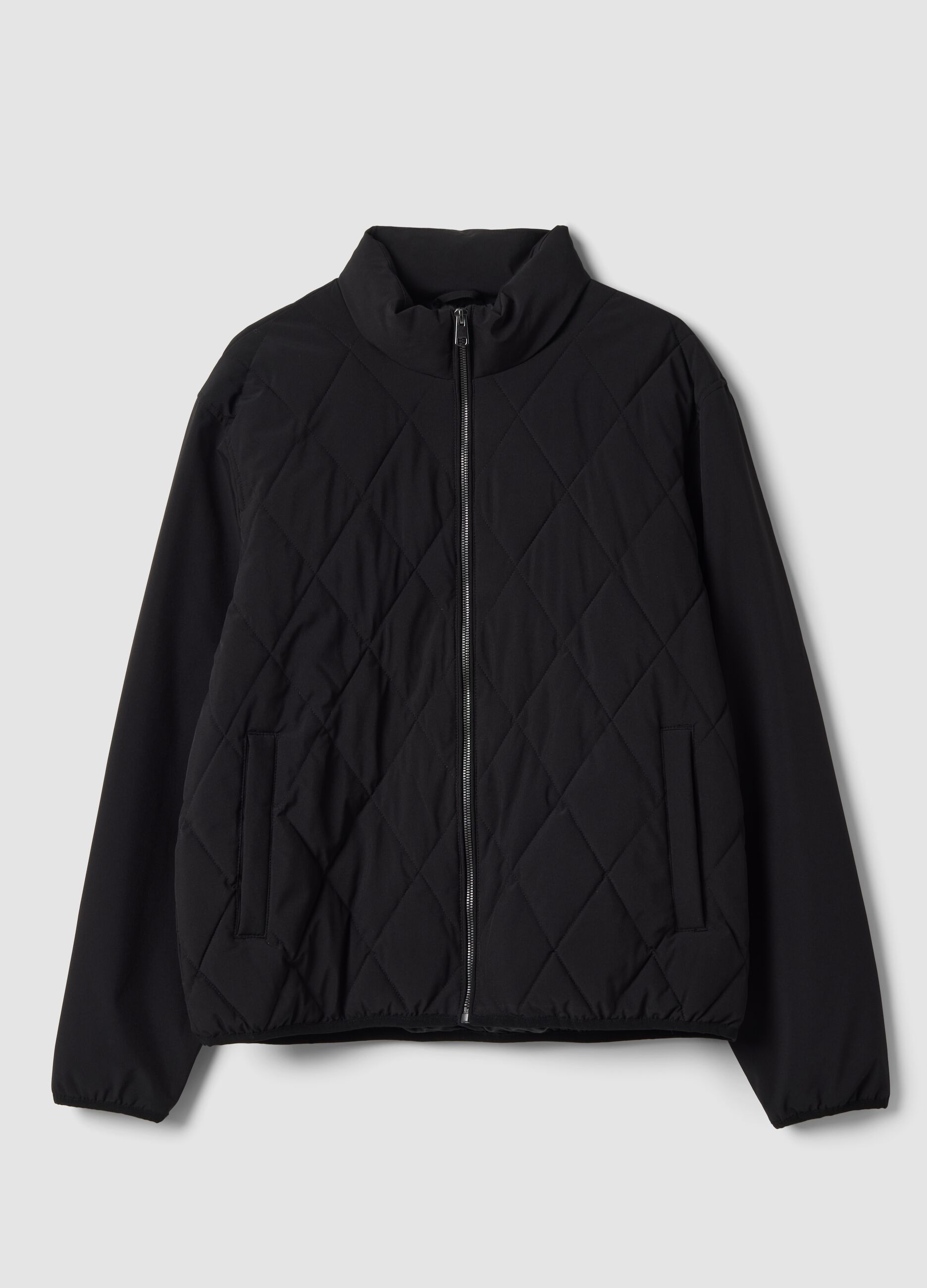Giacca nera in tessuto elasticizzato con zip