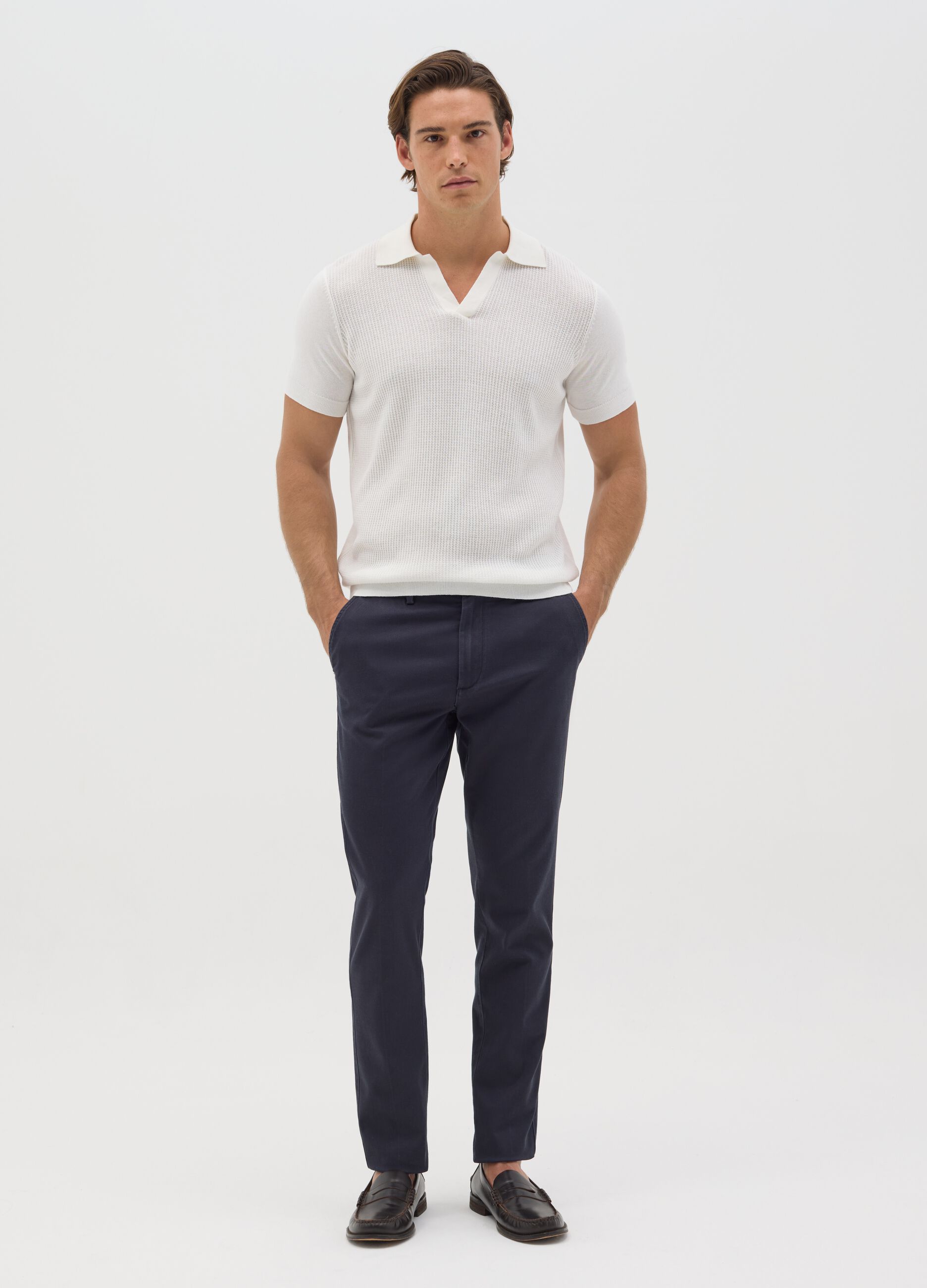Polo bianca in maglia con trama jacquard