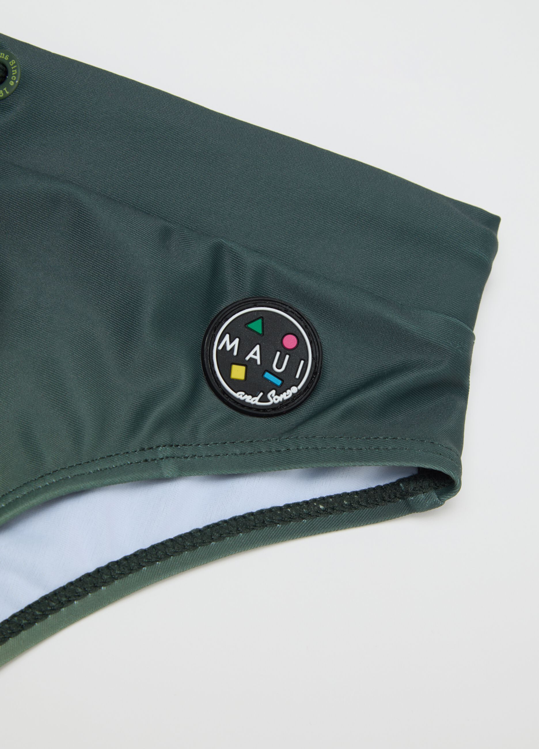 Slip da ragazzo in tessuto elasticizzato verde con logo