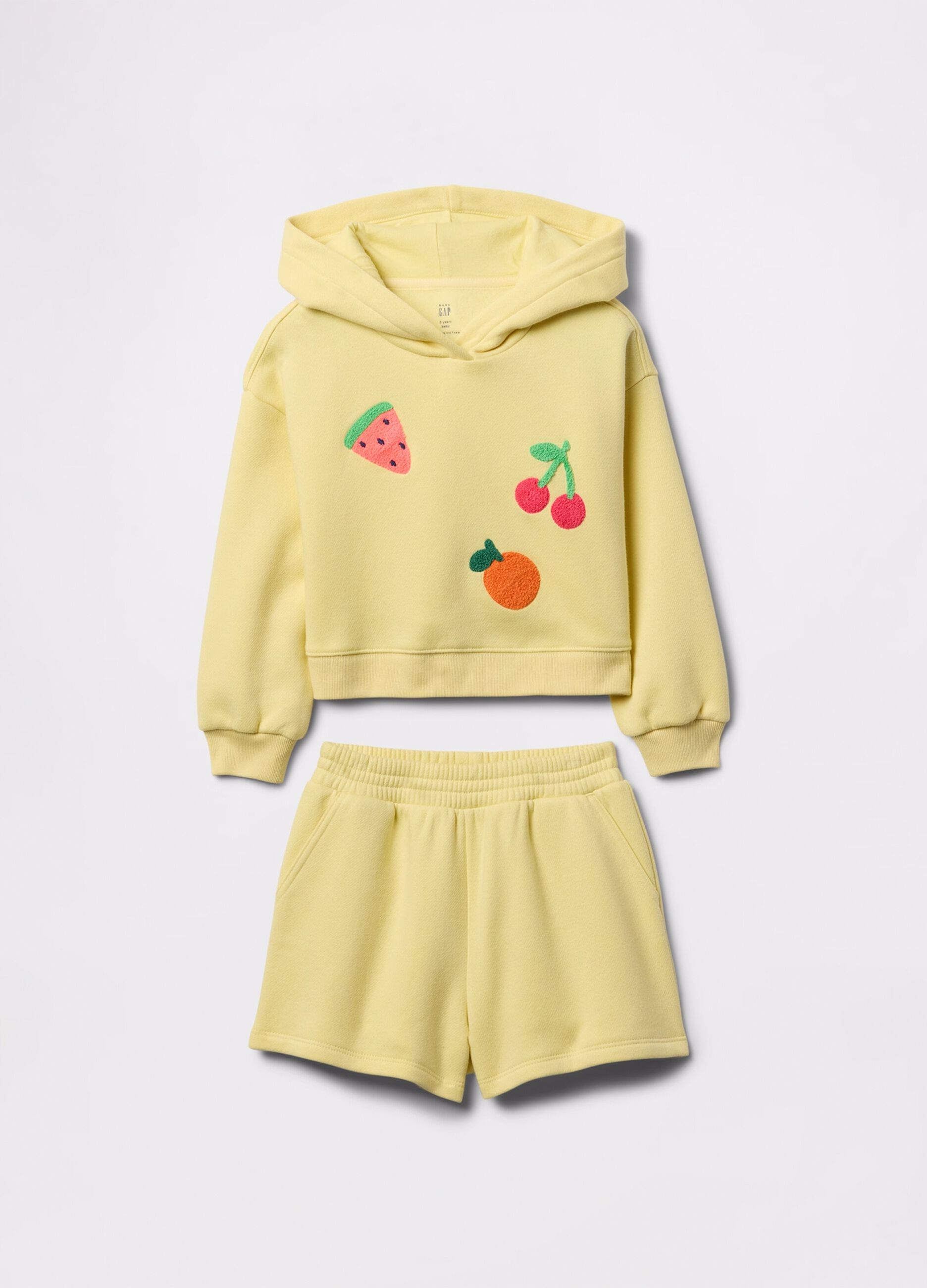 Yellow jogging set with bouclé fruit patch