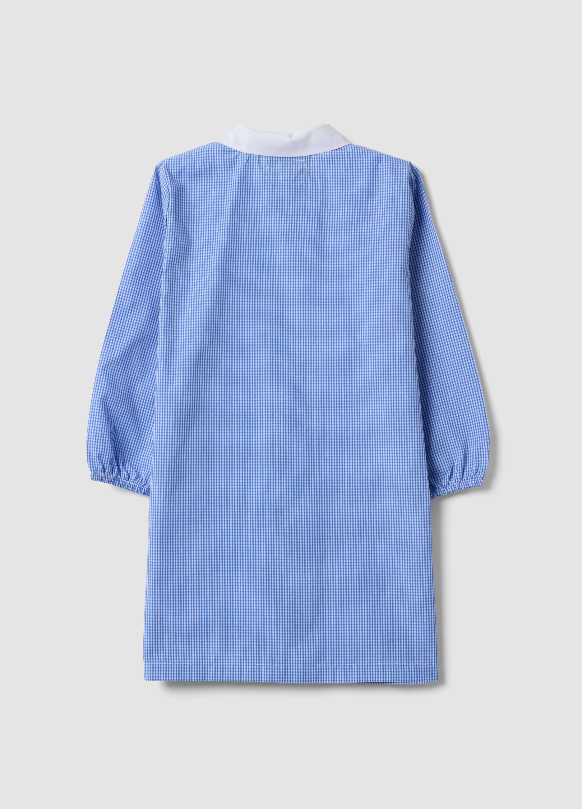 Blue gingham nursery apron with zip and animal embroidery