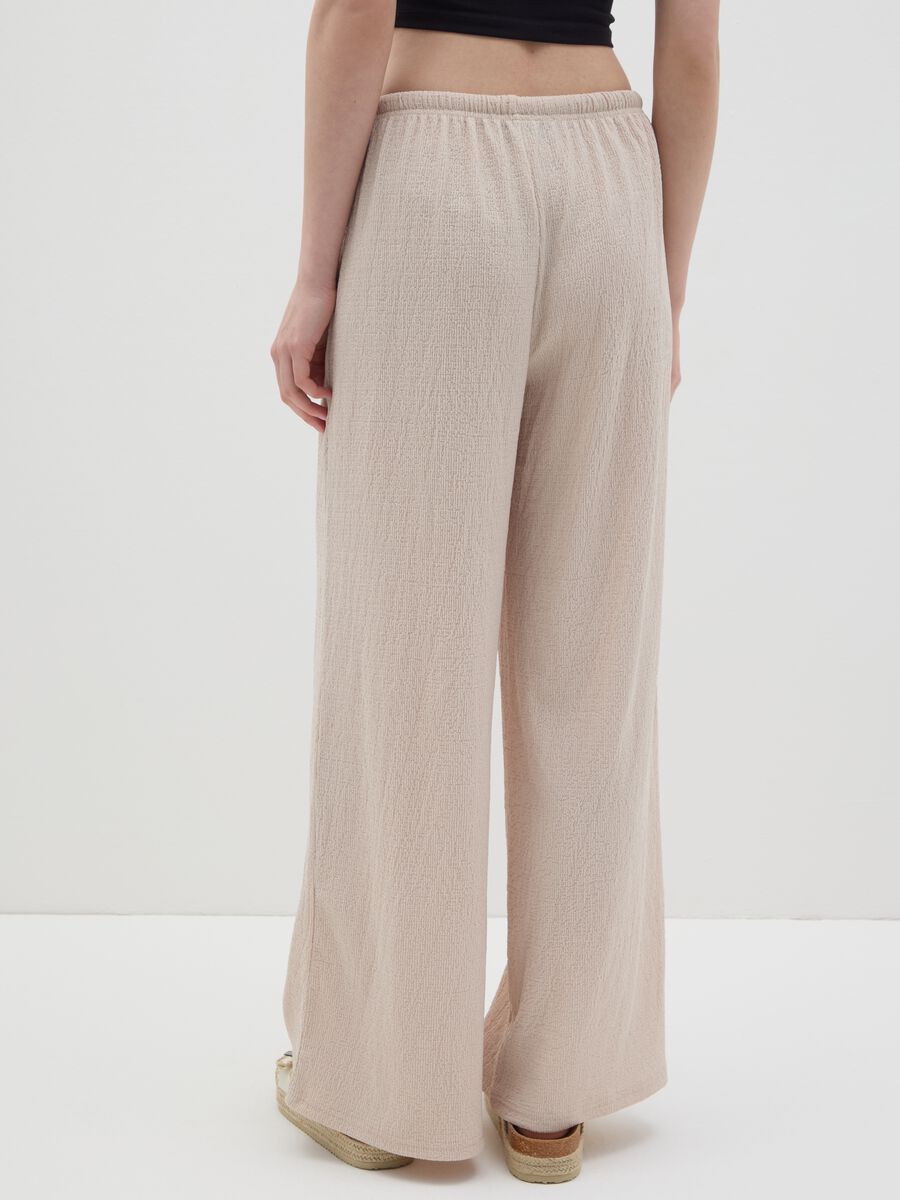 Women's beige regular-fit palazzo pants in stretch fabric._3