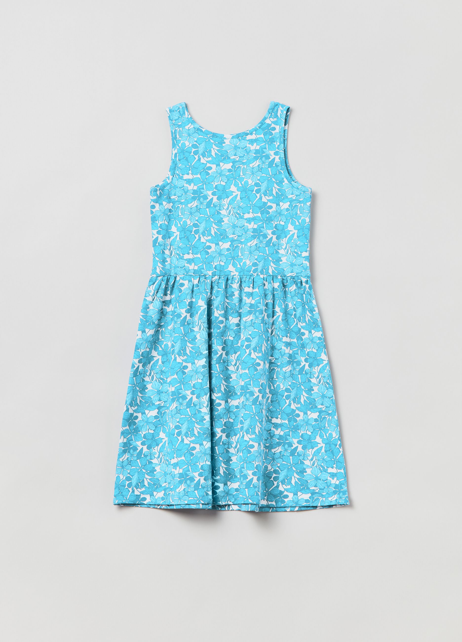 Sleeveless dress with floral pattern.