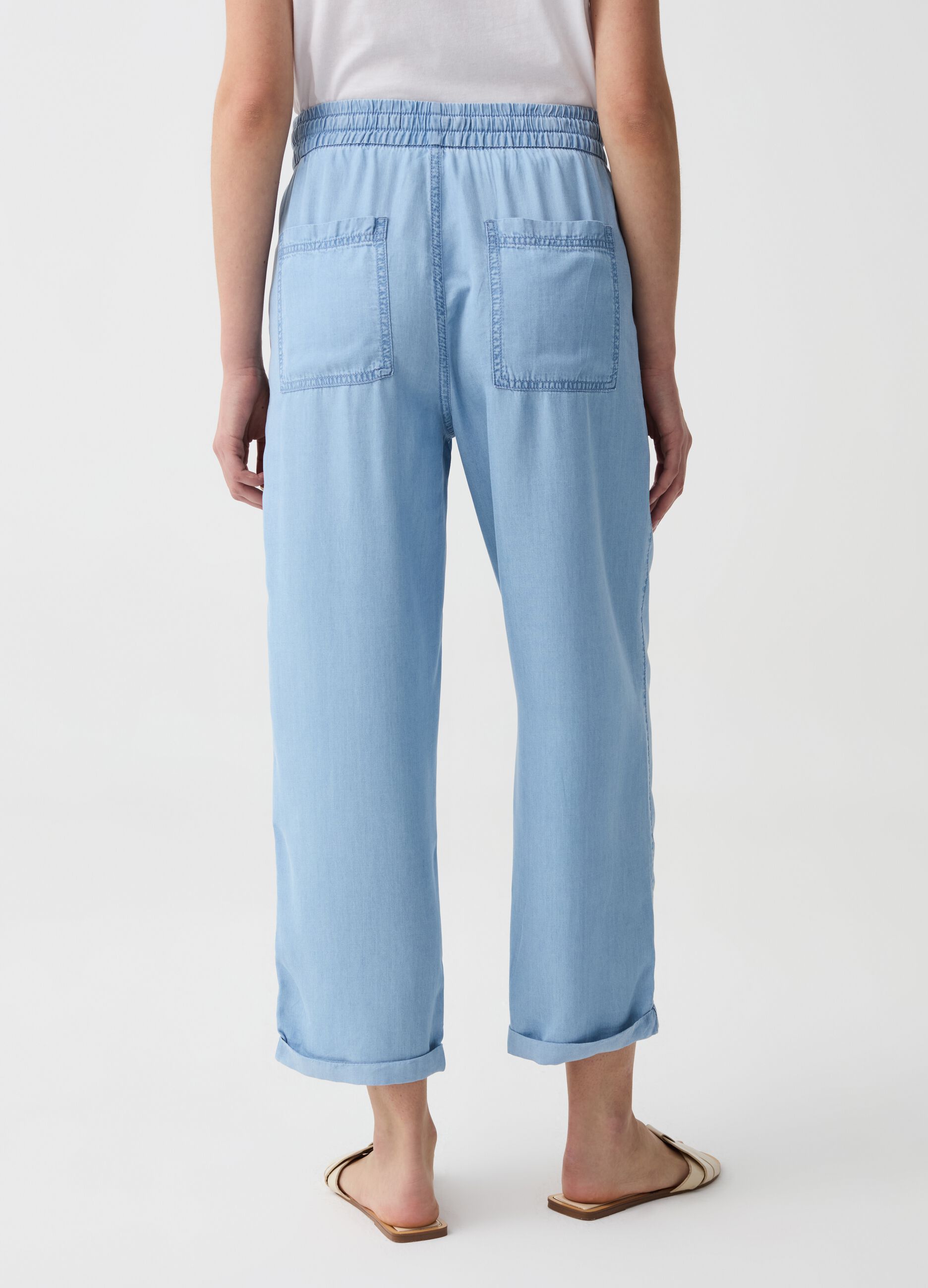 Joggers wide leg effetto denim con risvolti