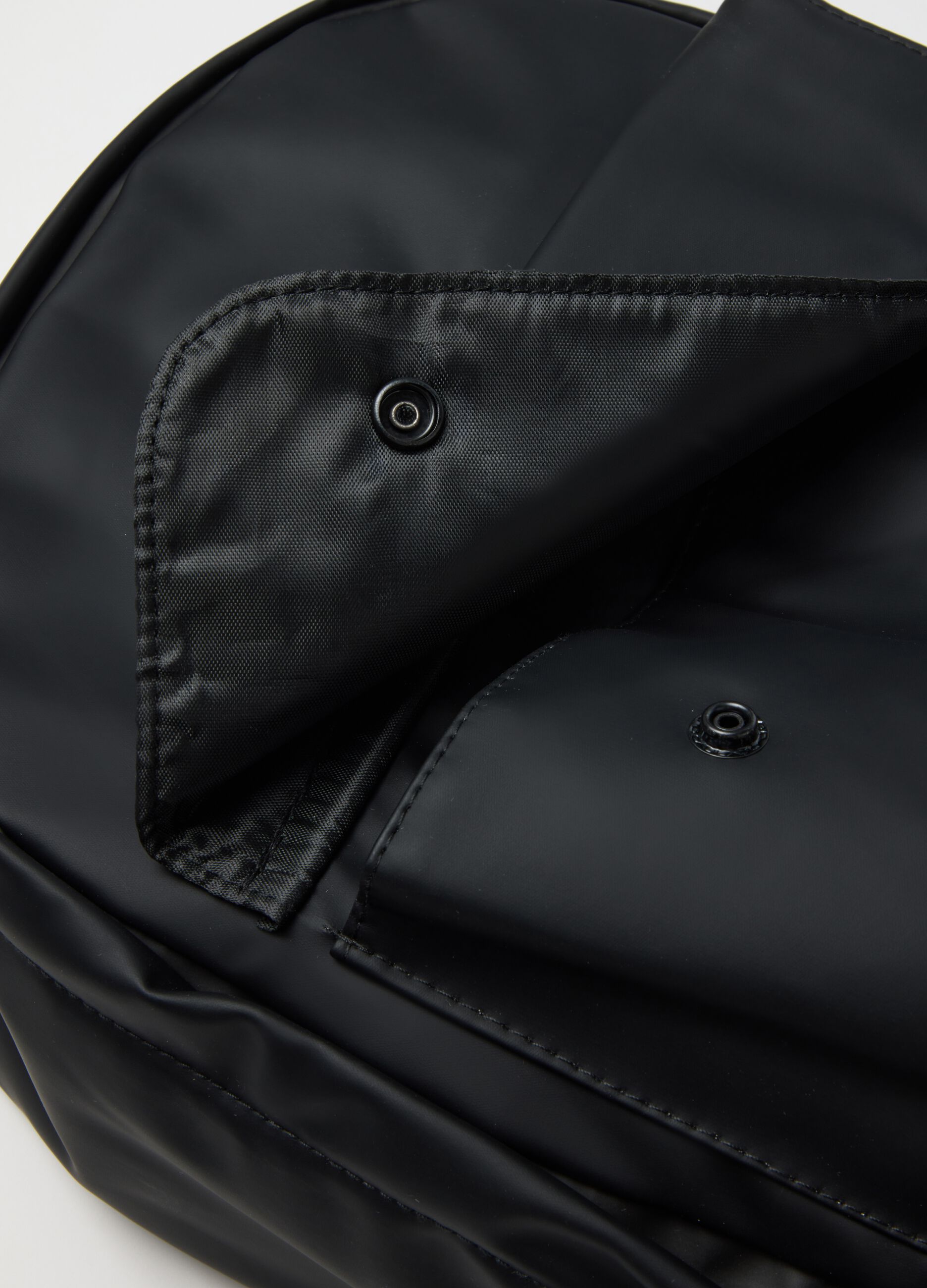 Black backpack with adjustable shoulder straps and front pocket