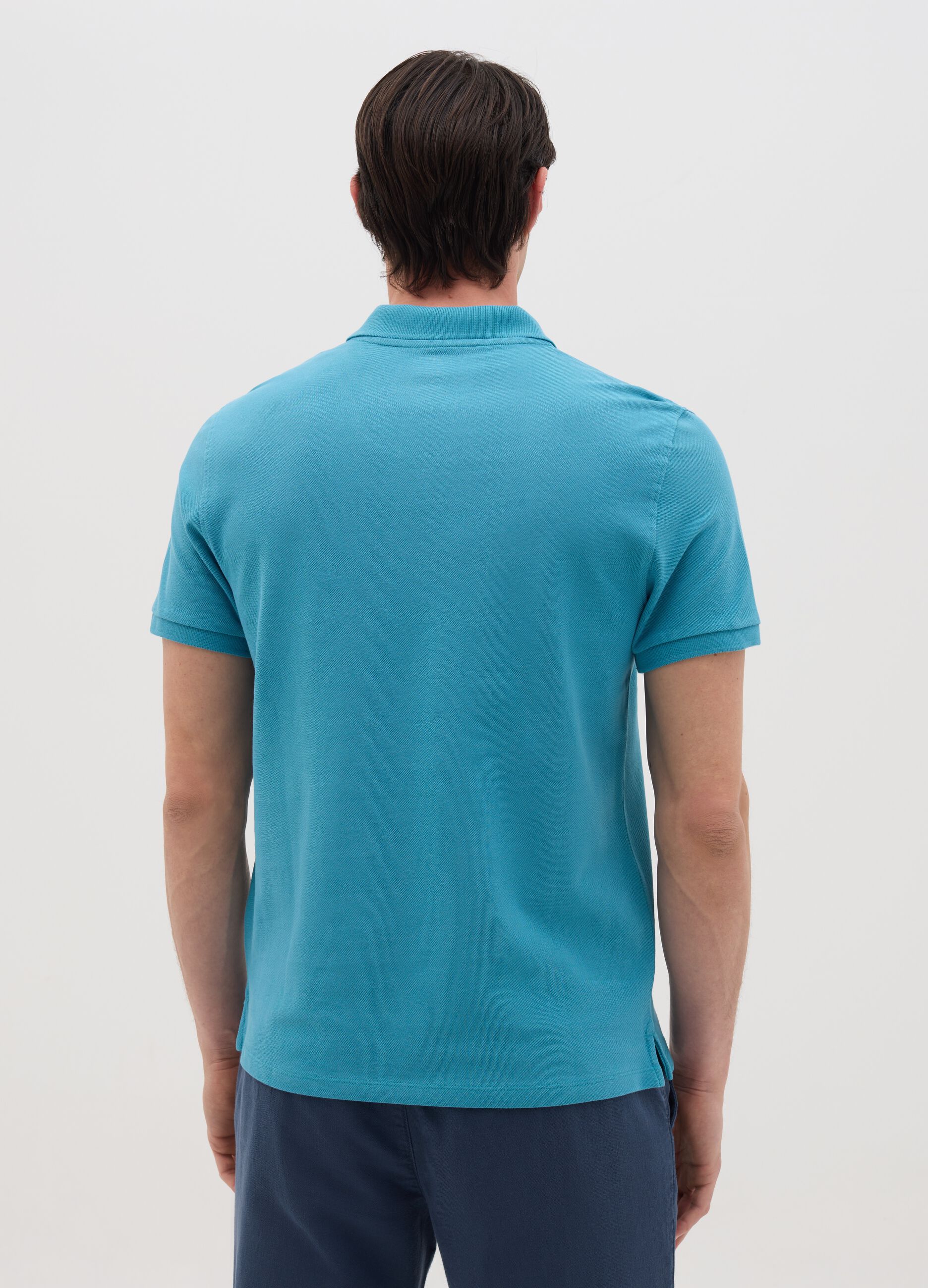 Men’s light blue polo shirt in 100% cotton with regular fit