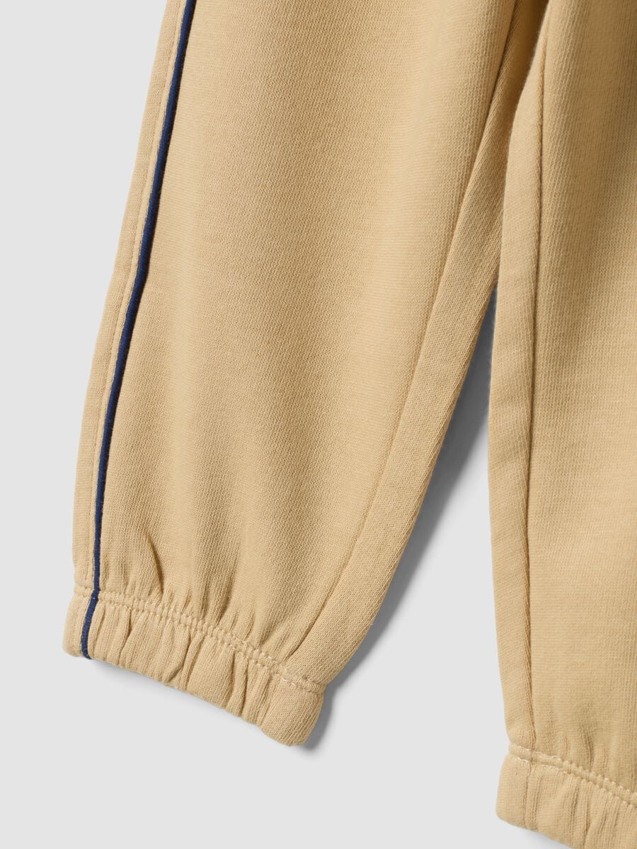 Pantaloni jogger beige in puro cotone con stampa_3
