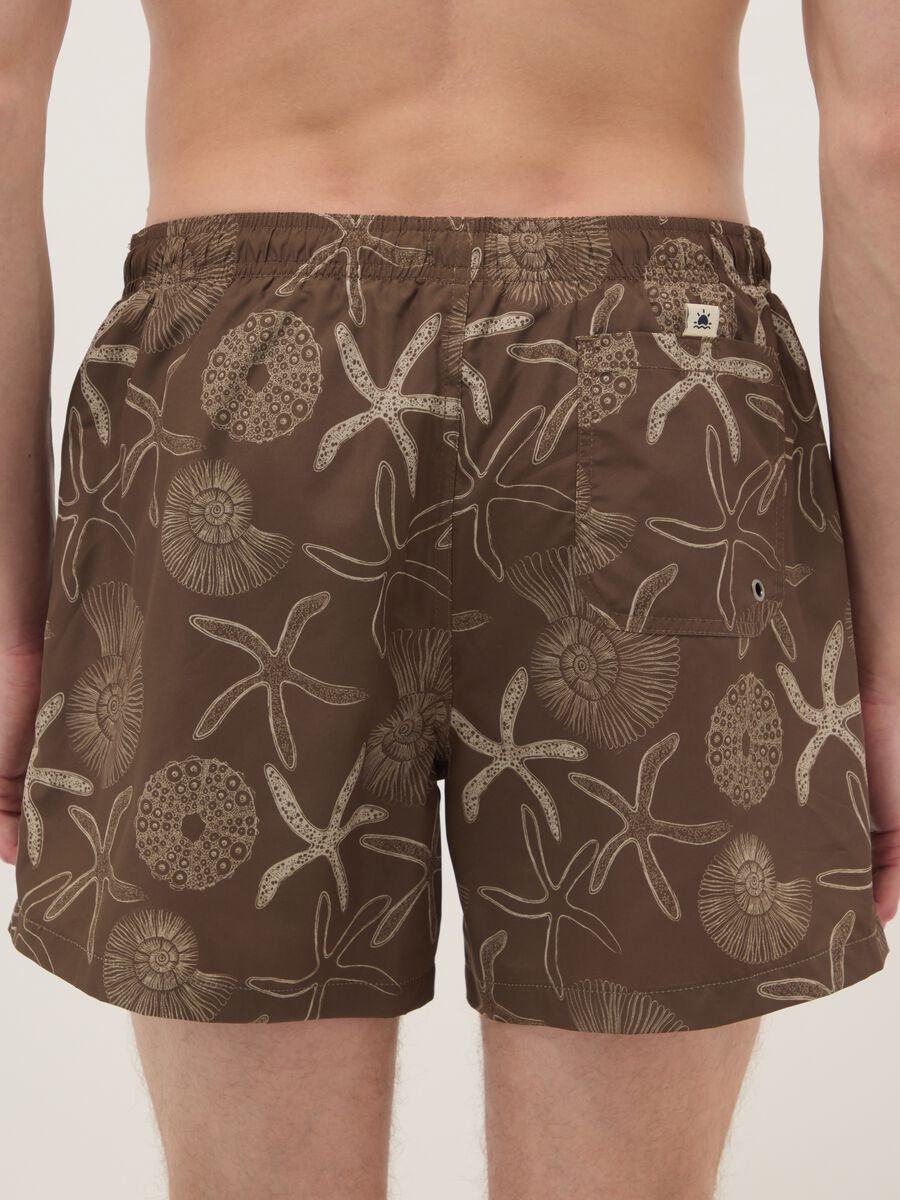 Brown swim shorts with seashell and starfish print_2