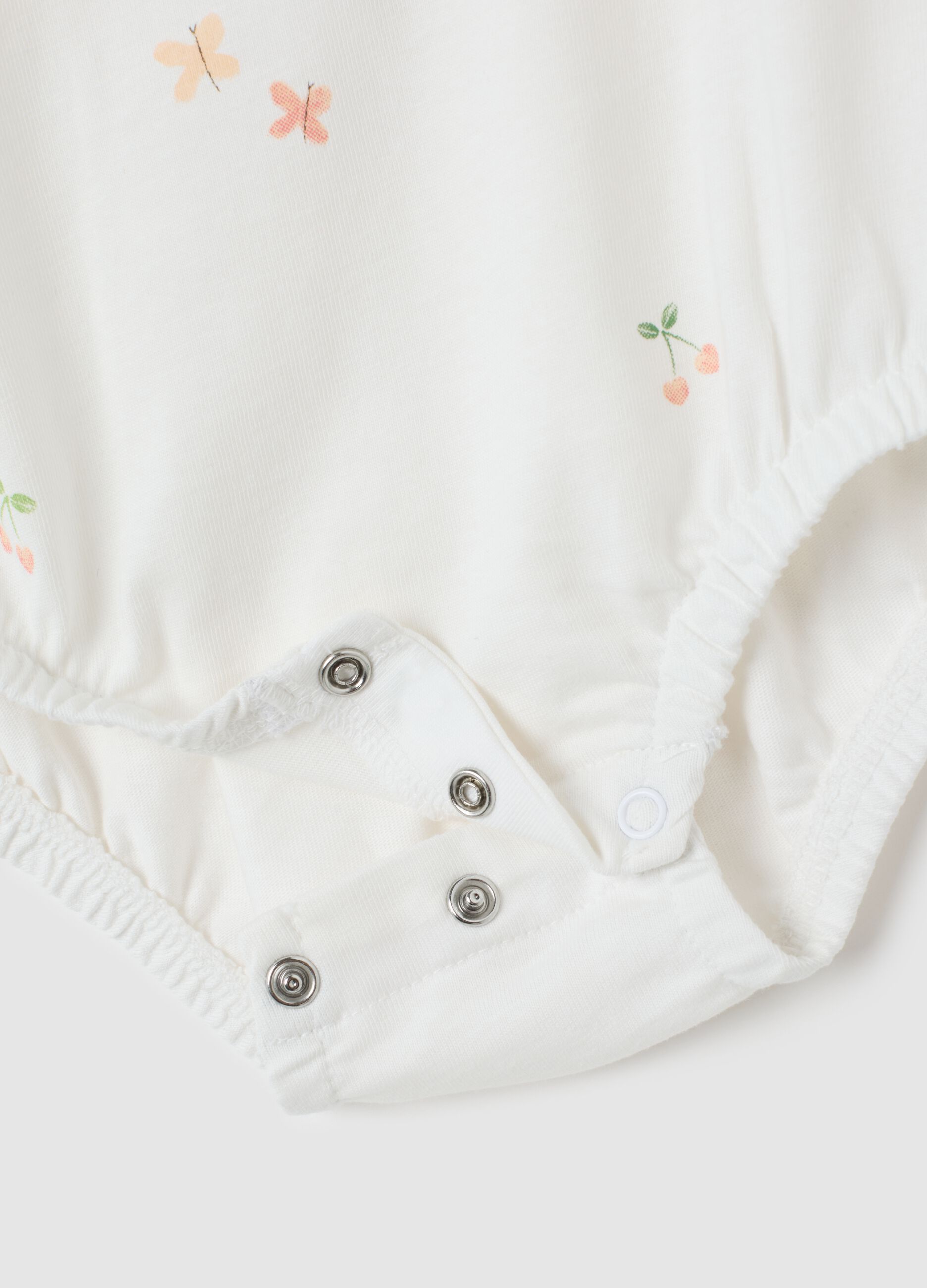 Body da neonata in puro cotone bianco con ruches