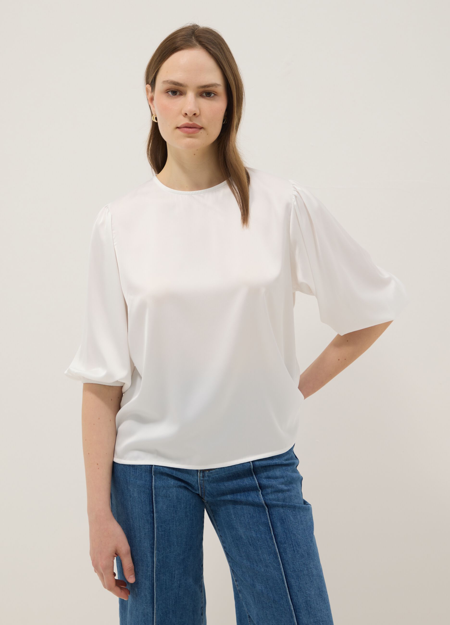 White long-sleeve top with wide sleeves