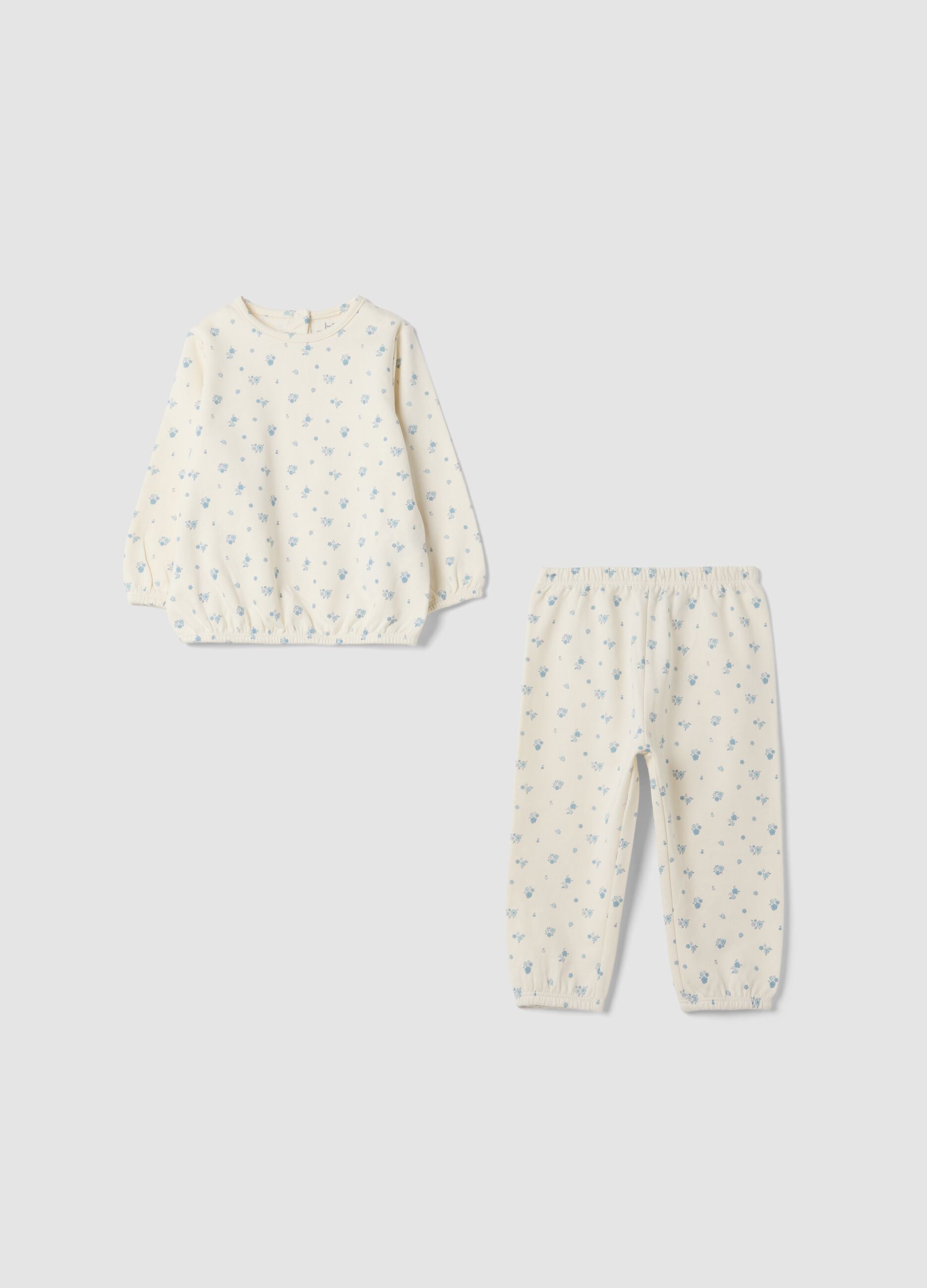 White organic cotton baby pyjamas with all-over print