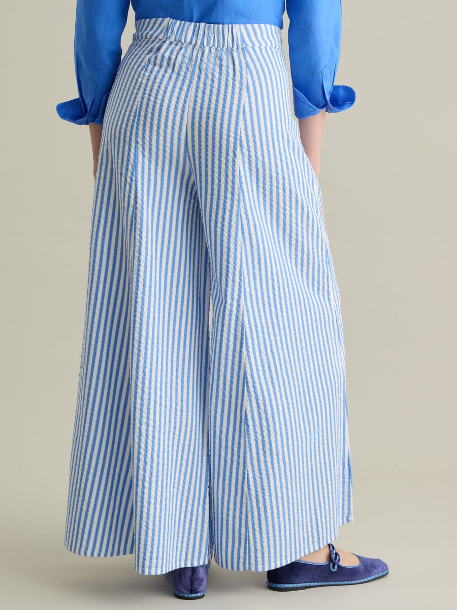 Blue flare-fit trousers in striped seersucker_2