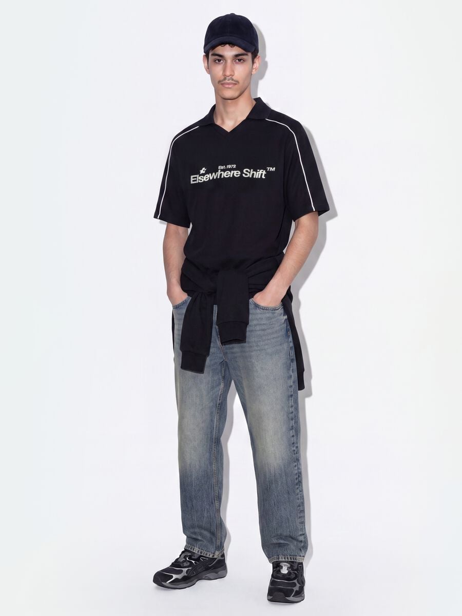 Polo nera in puro cotone over fit a maniche corte over fit_1