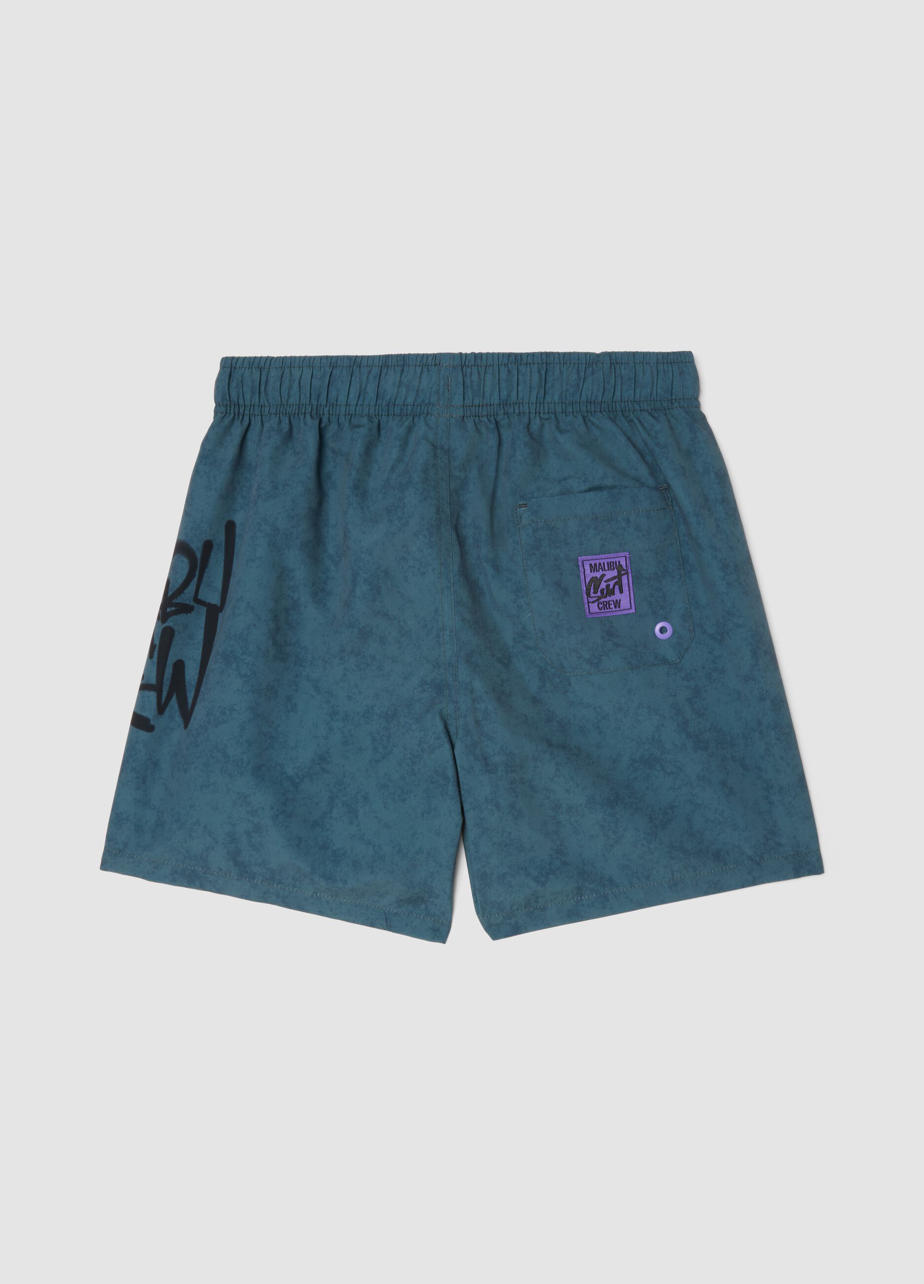 Blue swim shorts with print