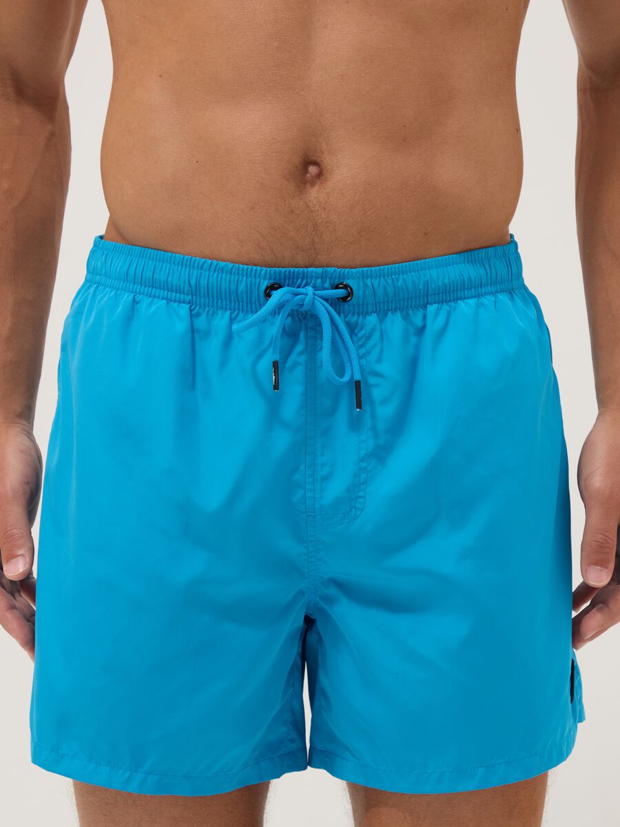 Blue swim shorts with elasticated waist and drawstring_2