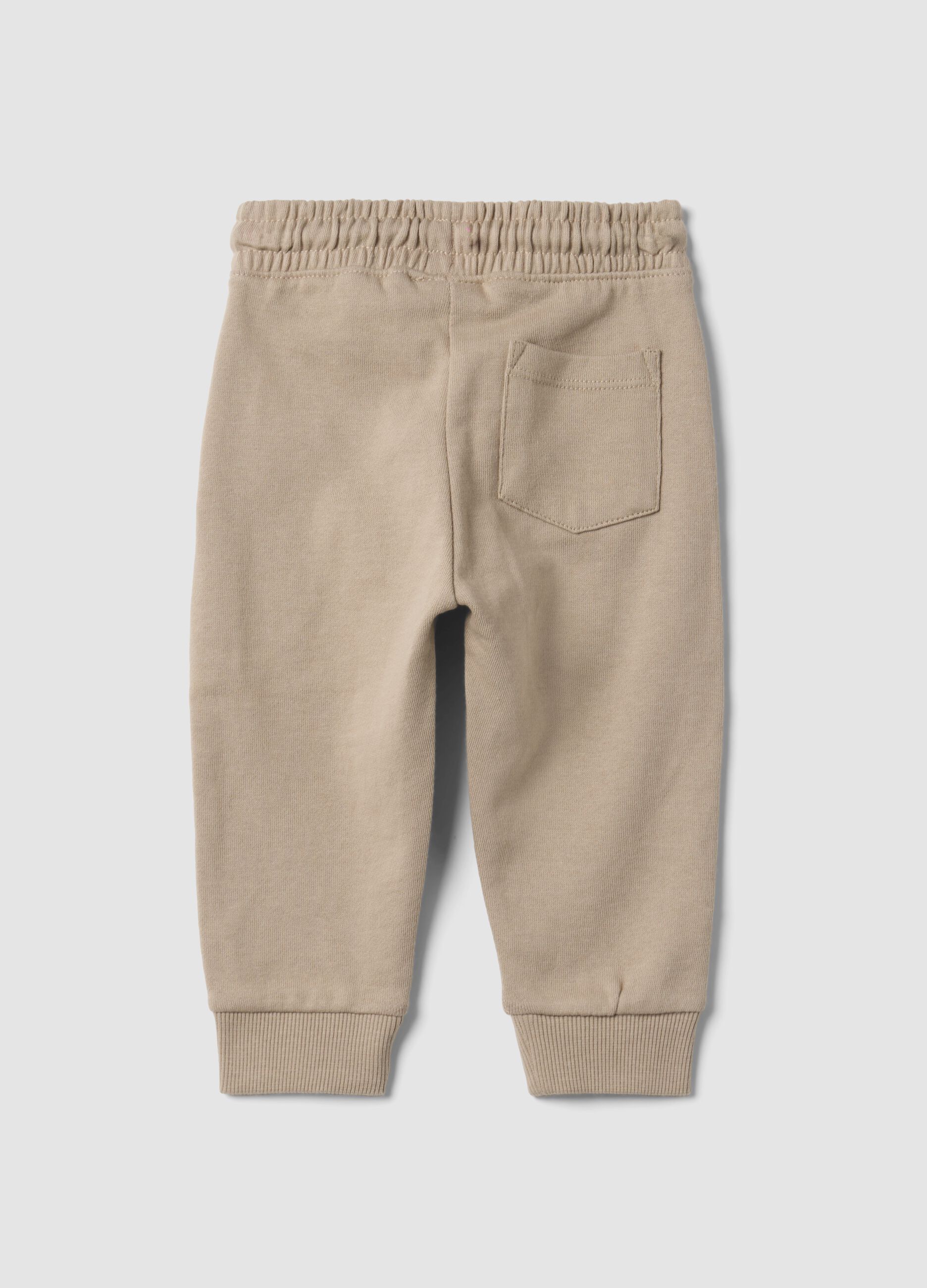 Pantaloni jogger beige in puro cotone con stampa cagnolino per bimbo